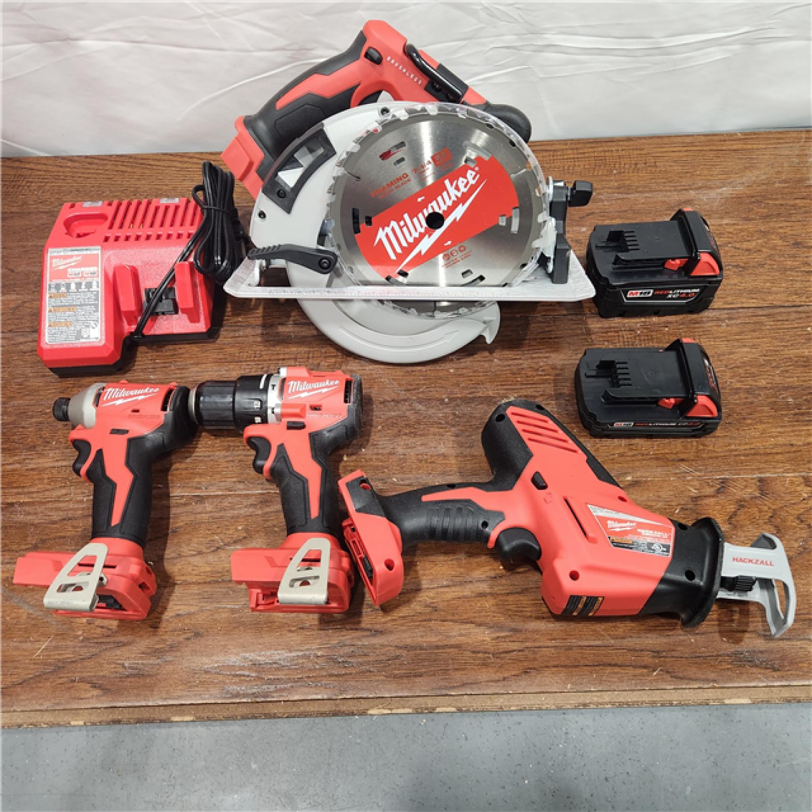 AS-IS M18 18-Volt Lithium-Ion Brushless Cordless Combo Kit (4-Tool) with 2-Batteries, 1-Charger and Tool Bag