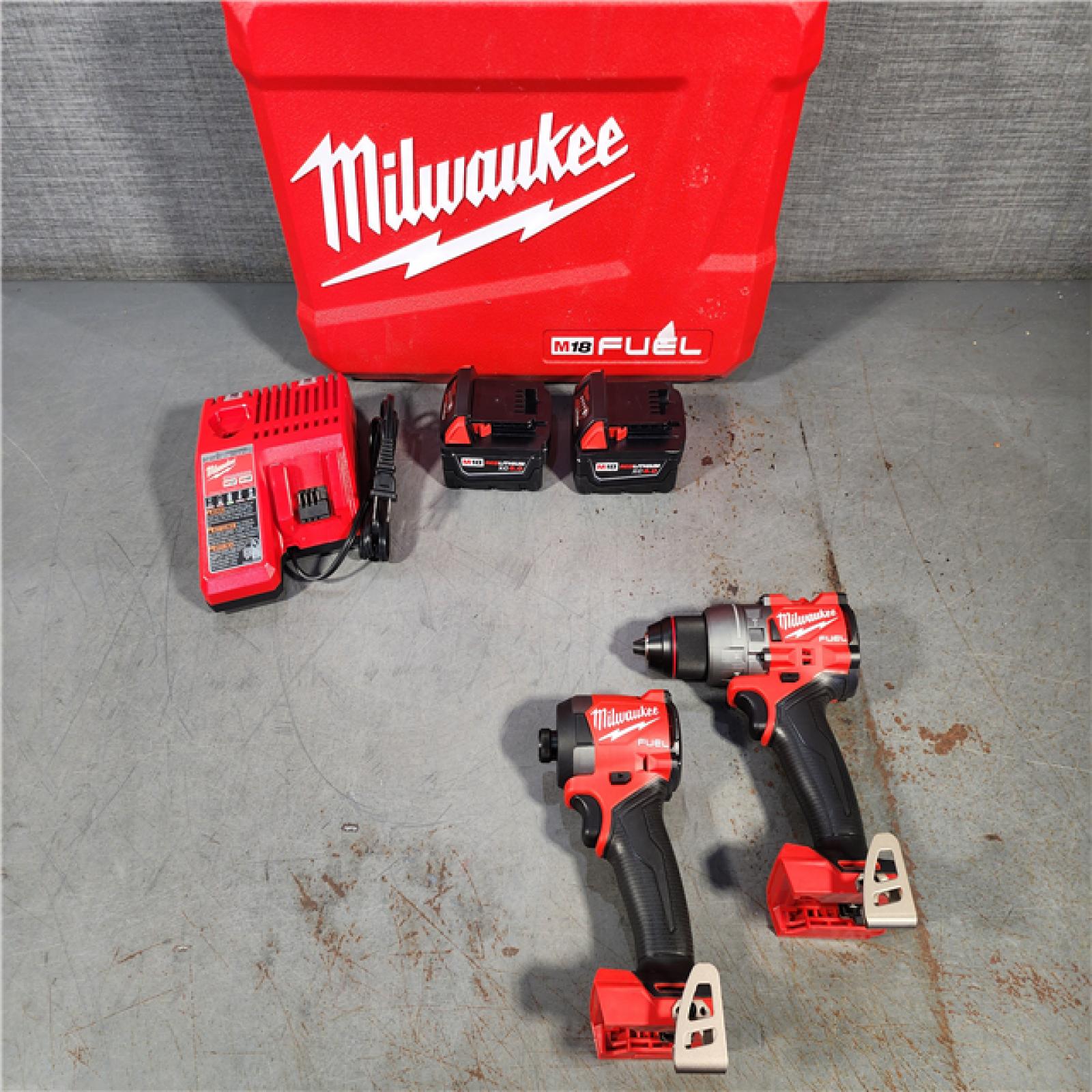 HOUSTON LOCATION - AS-IS (APPEARS LIKE NEW) Milwaukee M18 FUEL 18V Lithium-Ion Brushless Cordless Hammer Drill and Impact Driver Combo Kit (2-Tool) with 2 Batteries