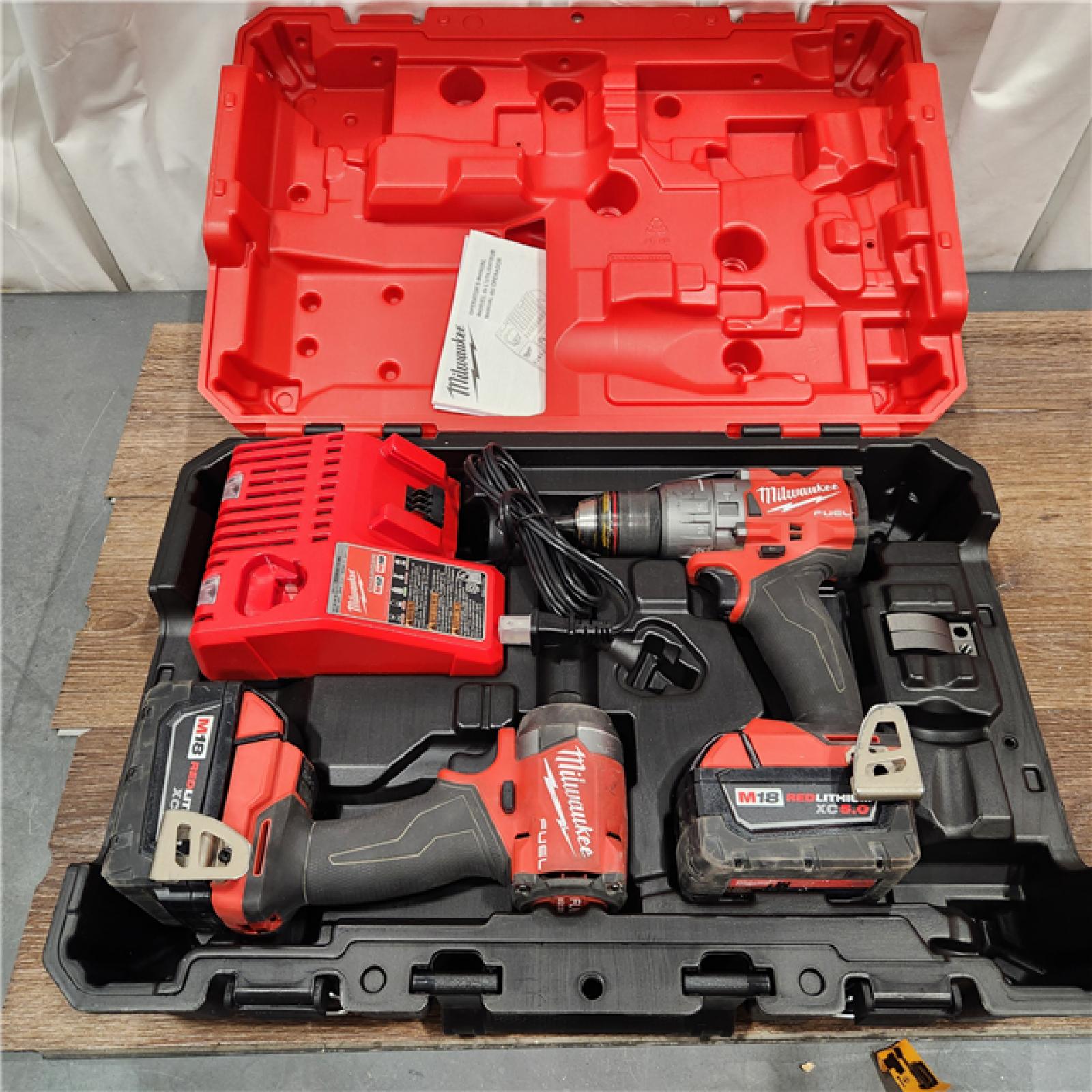 AS-IS Milwaukee M18 FUEL 18V Lithium-Ion Brushless Cordless Hammer Drill and Impact Driver Combo Kit (2-Tool) with 2 Batteries