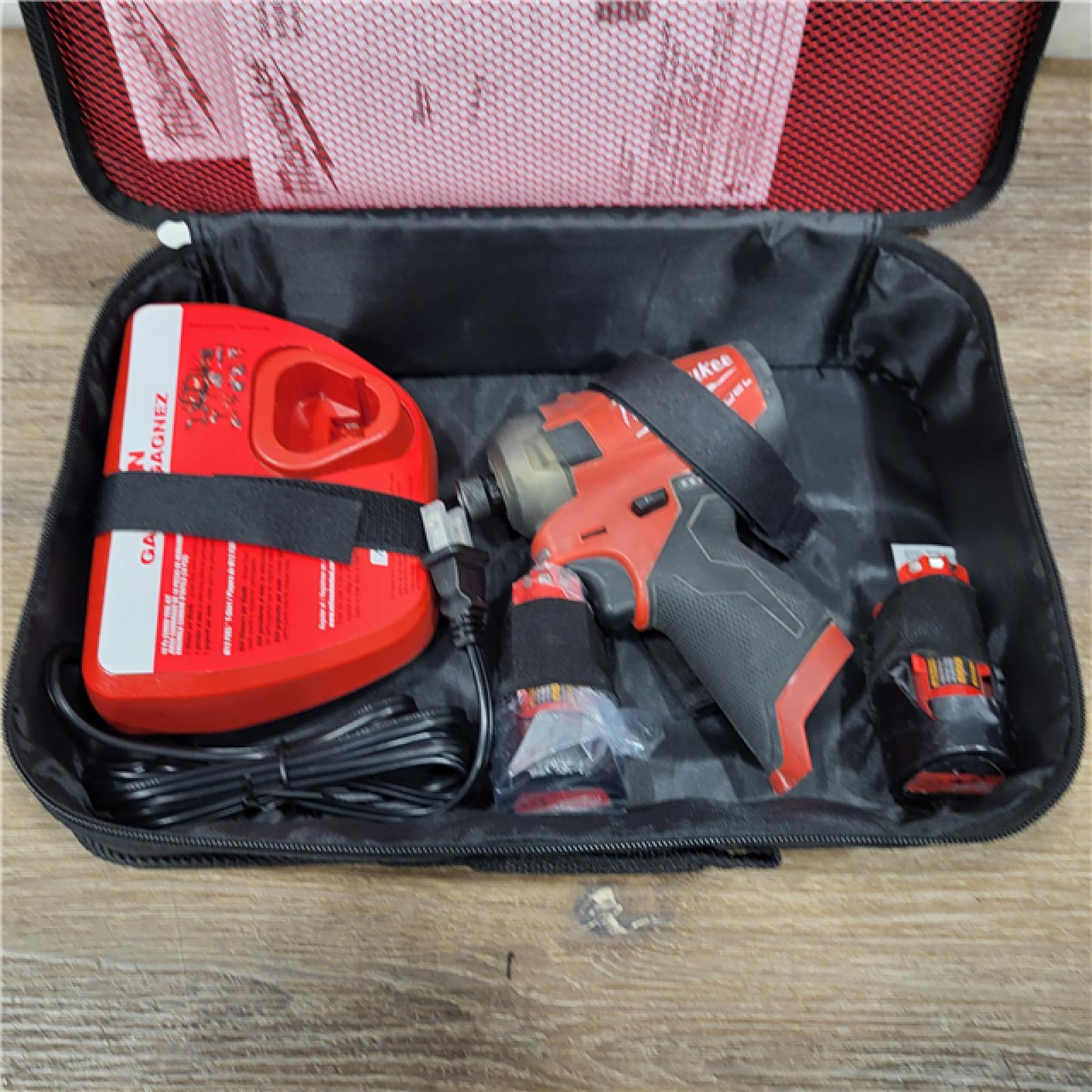 AS-IS M12 FUEL SURGE 12V Lithium-Ion Brushless Cordless 1/4 in. Hex Impact Driver Compact Kit W/Two 2.0Ah Batteries, Bag