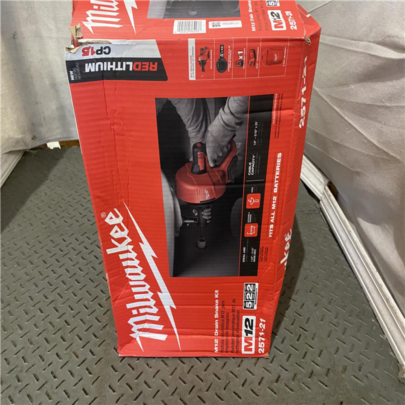 Houston location AS-IS MILWAUKEE M12 12-V Lithium-Ion Cordless Drain Snake Auger W/ (1) 1.5Ah Battery, 5/16 in. X 25 Ft. Cable, Charger, & 5 Gal. Bucket