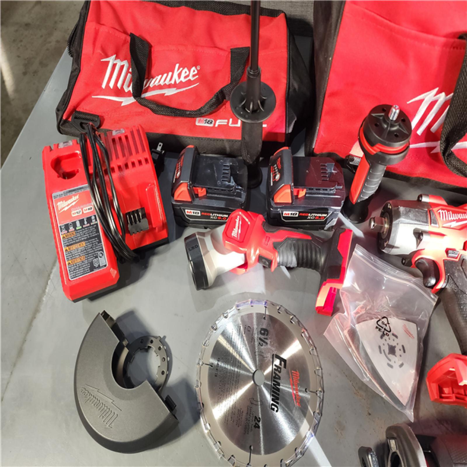 HOUSTON LOCATION - AS-IS Milwaukee M18 FUEL 18V Lithium-Ion Brushless Cordless Combo Kit with Two 5.0 Ah Batteries  1 Charger  2 Tool Bags (7-Tool)