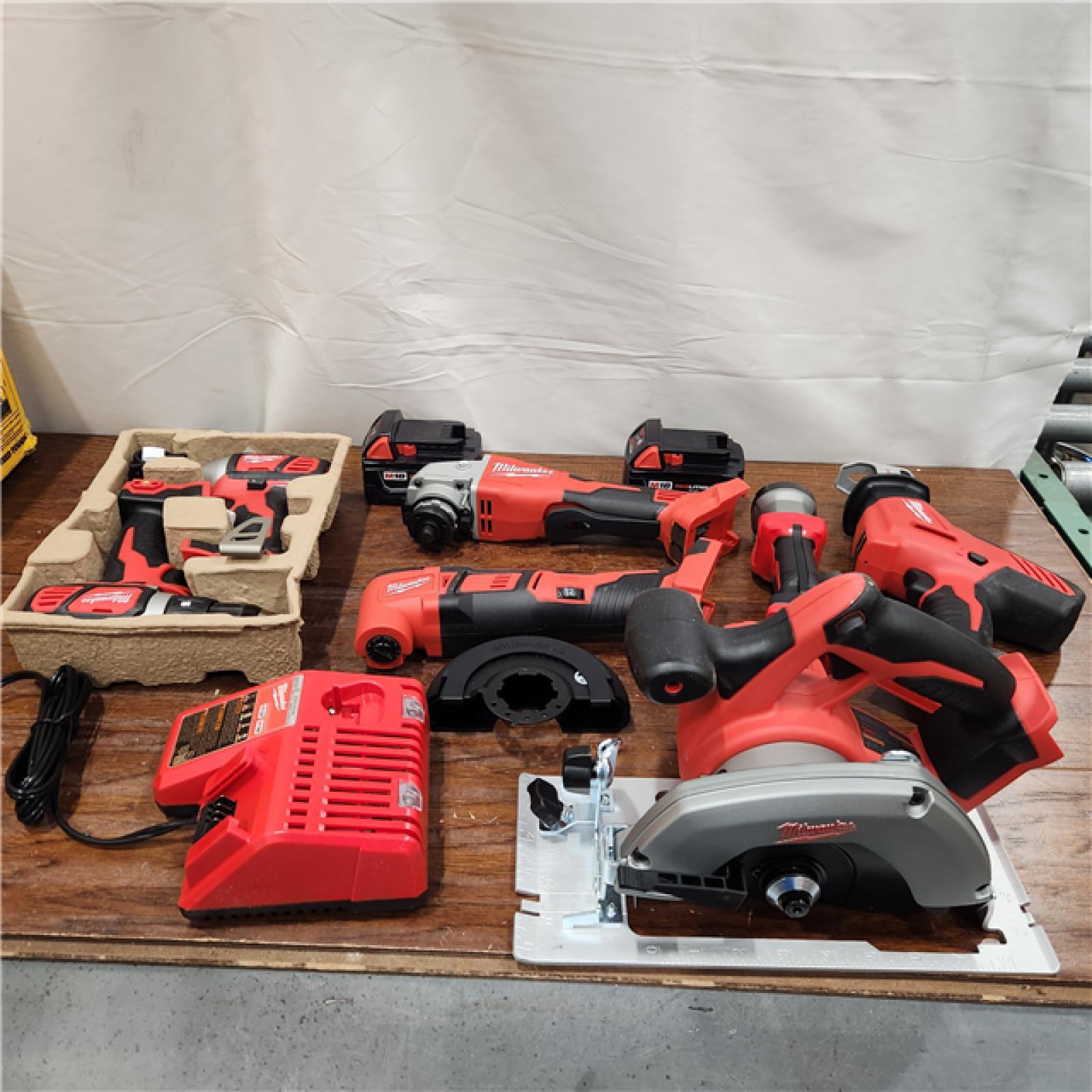 AS-IS Milwaukee M18 18-Volt Lithium-Ion Cordless Combo Kit 7-Tool with 2-Batteries, Charger and Tool Bag