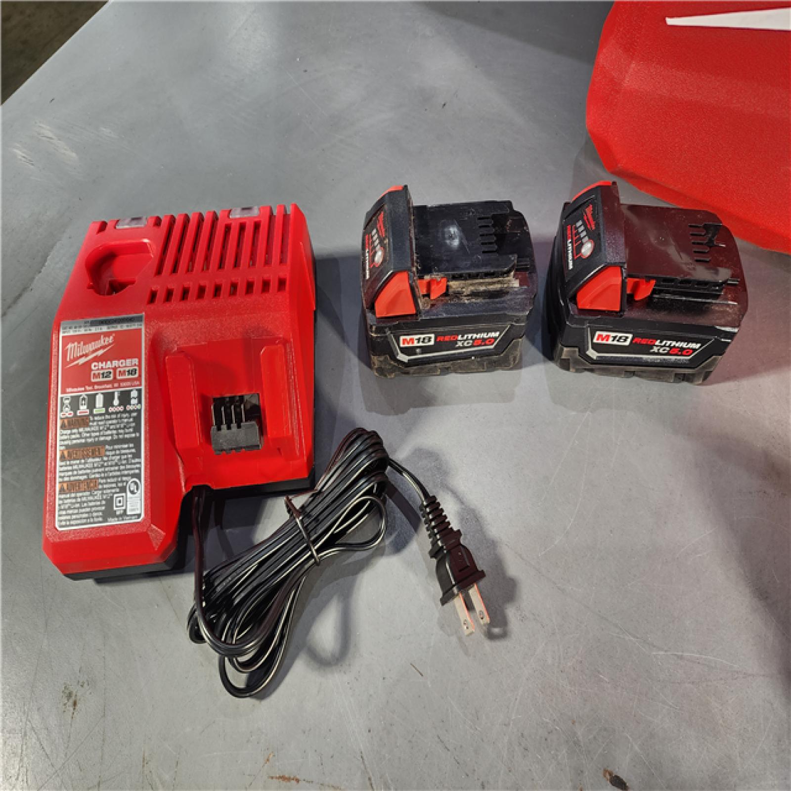 HOUSTON LOCATION - AS-IS (APPEARS LIKE NEW) Milwaukee M18 FUEL 18V Lithium-Ion Brushless Cordless Hammer Drill and Impact Driver Combo Kit (2-Tool) with 2 Batteries