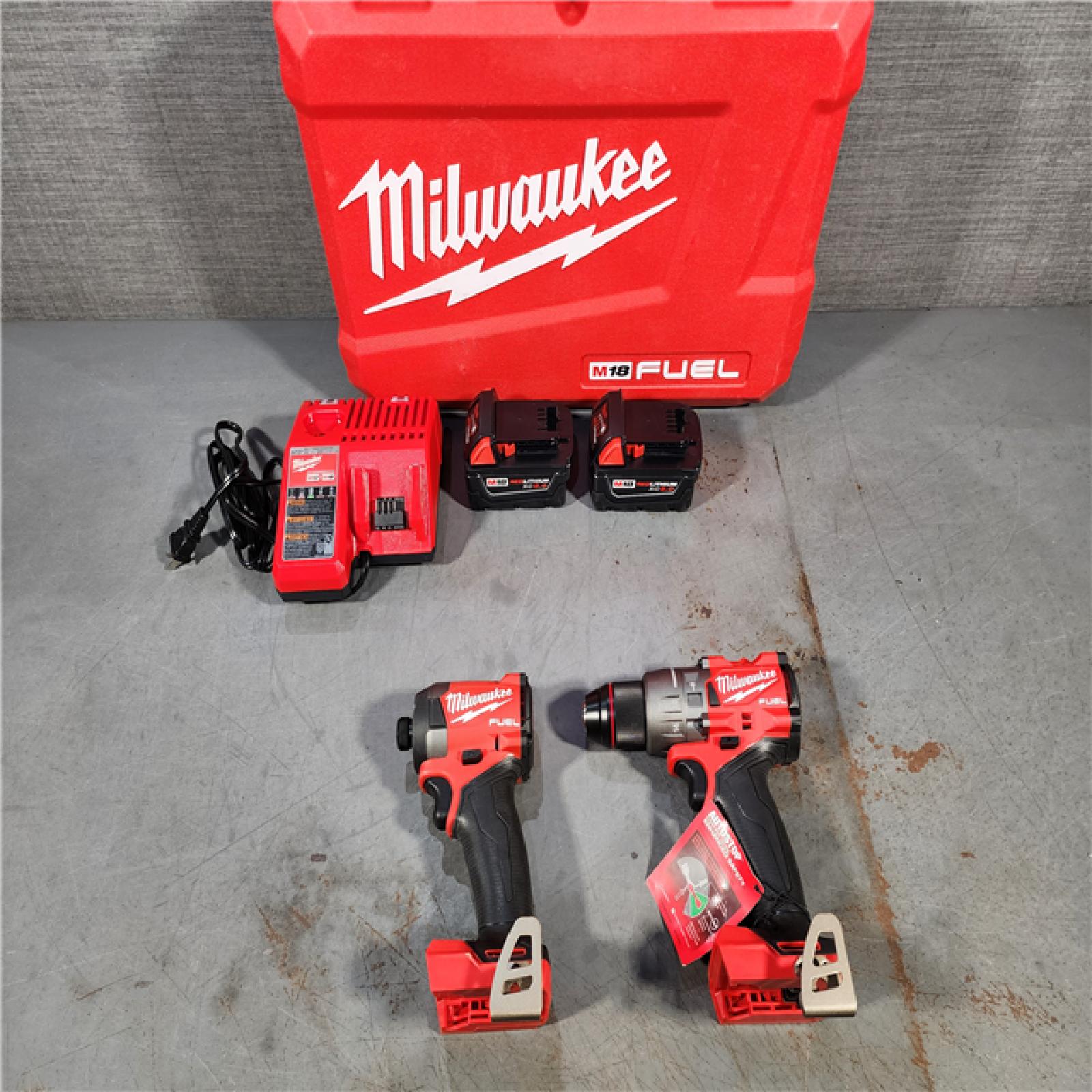 HOUSTON LOCATION - AS-IS (APPEARS LIKE NEW) Milwaukee M18 FUEL 18V Lithium-Ion Brushless Cordless Hammer Drill and Impact Driver Combo Kit (2-Tool) with 2 Batteries