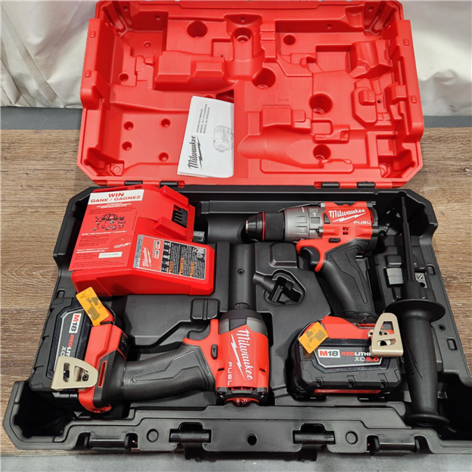 AS-IS Milwaukee M18 FUEL 18V Lithium-Ion Brushless Cordless Hammer Drill and Impact Driver Combo Kit (2-Tool) with 2 Batteries