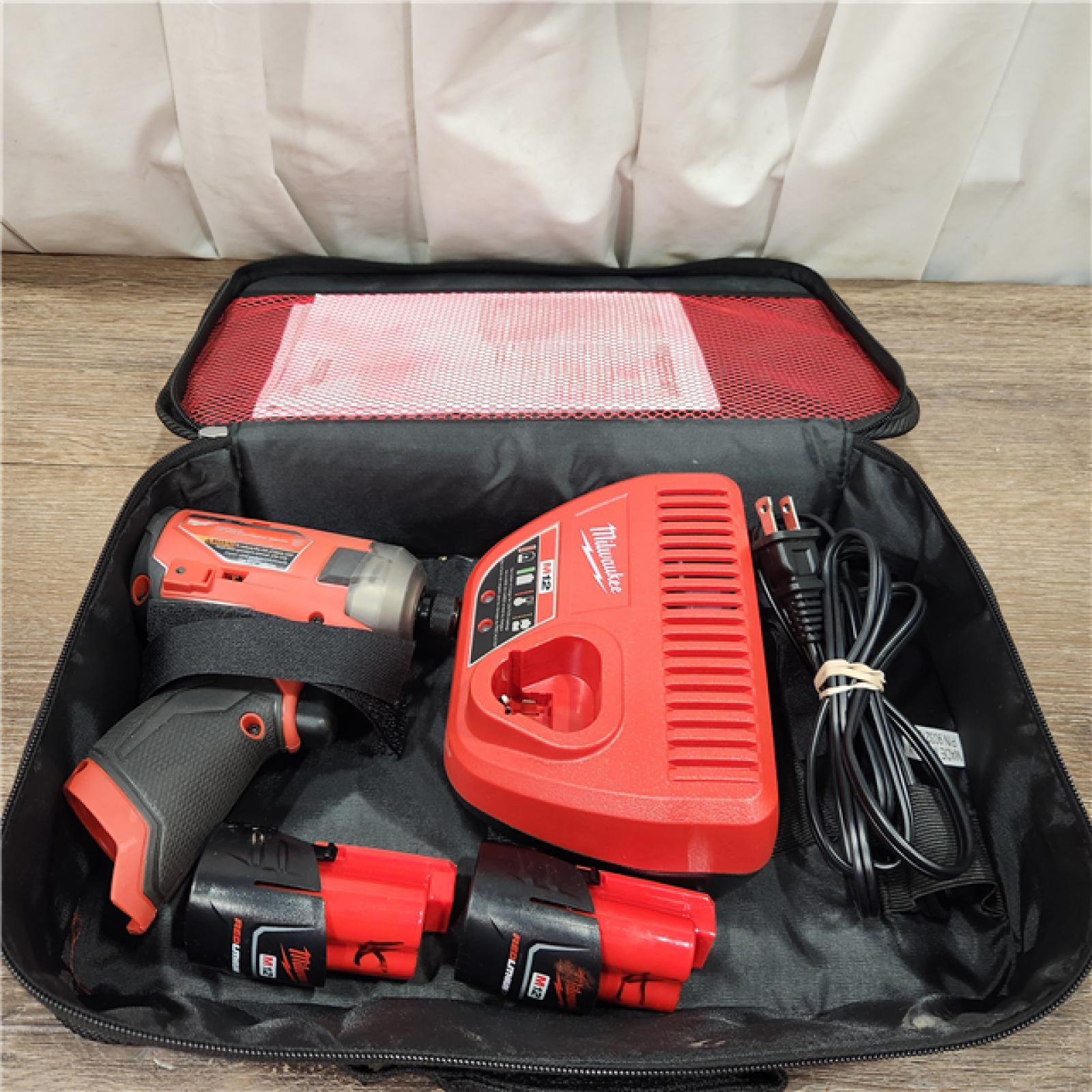 AS-IS M12 FUEL SURGE 12V Lithium-Ion Brushless Cordless 1/4 in. Hex Impact Driver Compact Kit W/Two 2.0Ah Batteries, Bag