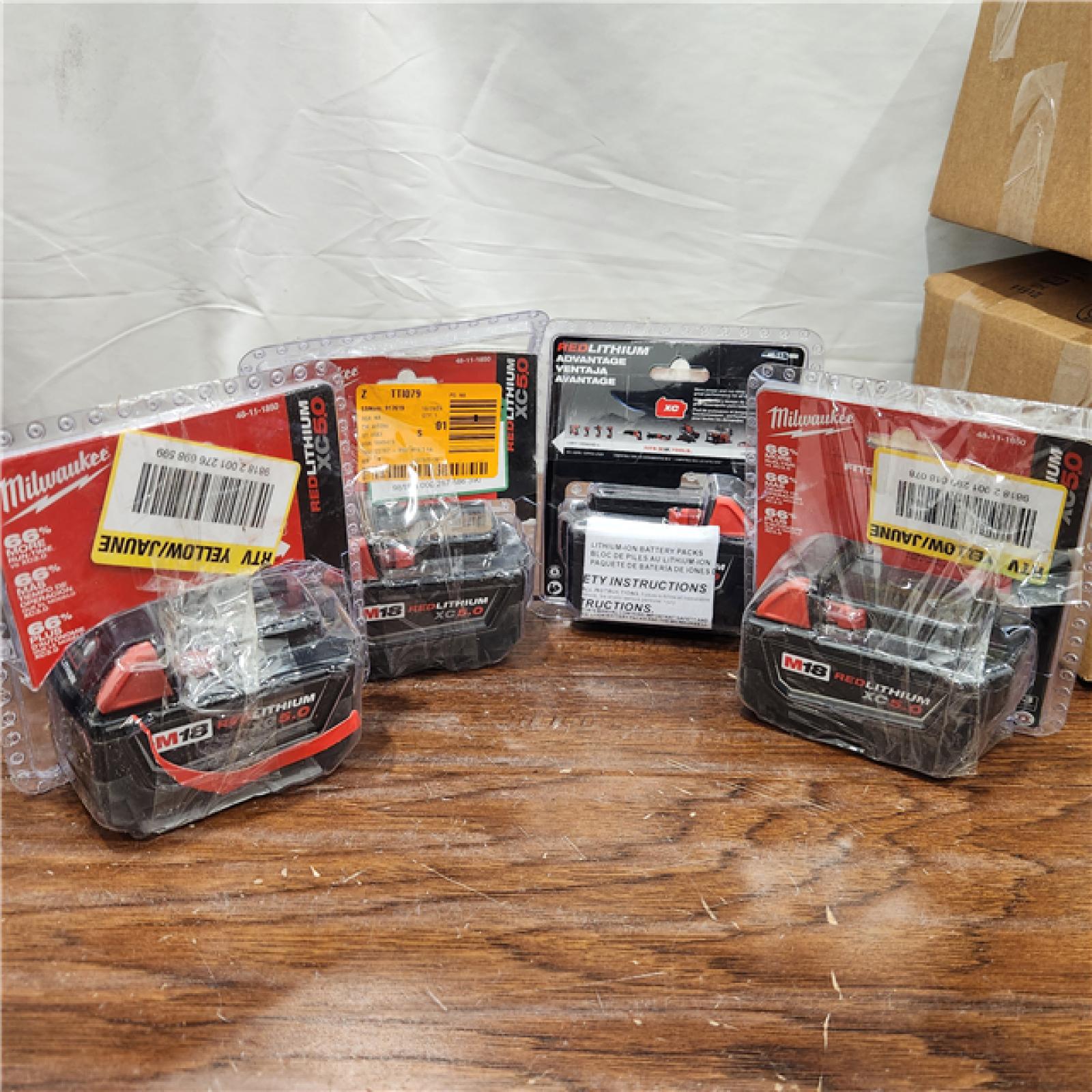 AS-IS Milwaukee M18 18-Volt Lithium-Ion XC Extended Capacity 5.0Ah Battery Pack	 (4PACK)