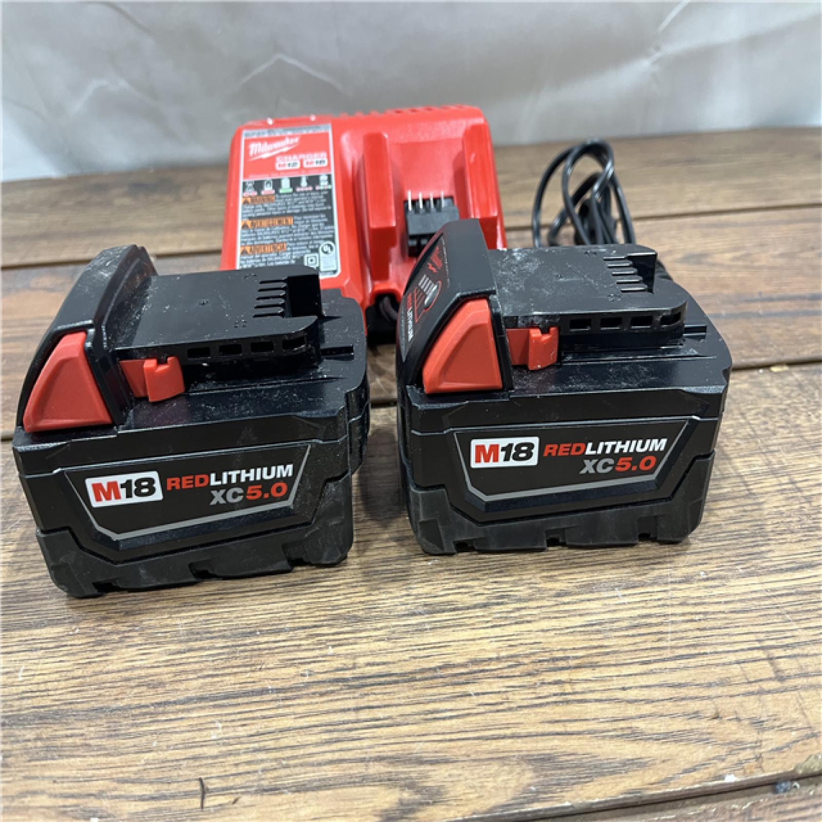 AS-IS Milwaukee M18 18-Volt Lithium-Ion XC Starter Kit with Two 5.0Ah Batteries and Charger