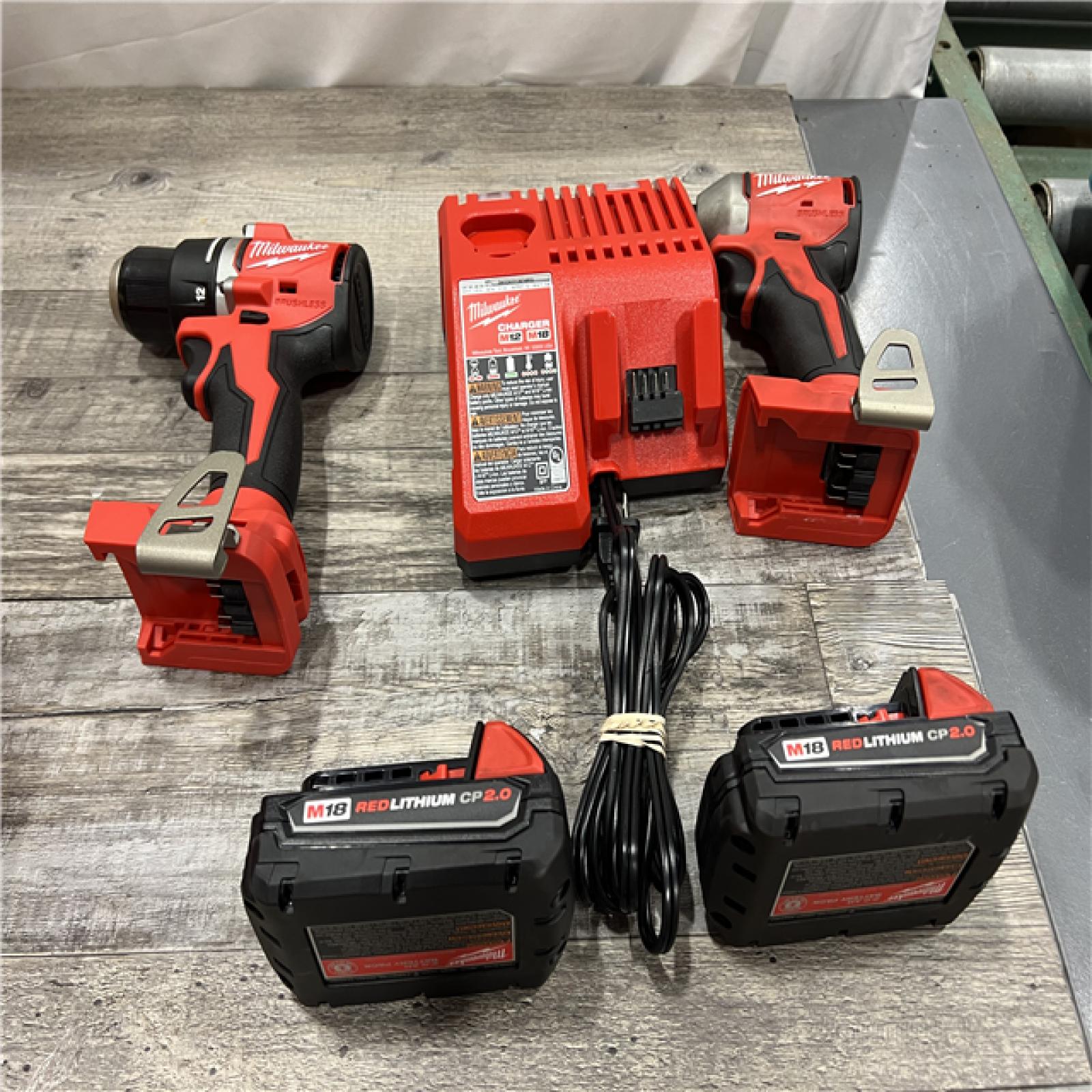 AS-IS MILWAUKEE M18 18V Lithium-Ion Brushless Cordless Compact Drill/Impact Combo Kit (2-Tool) W/(2) 2.0 Ah Batteries, Charger & Bag