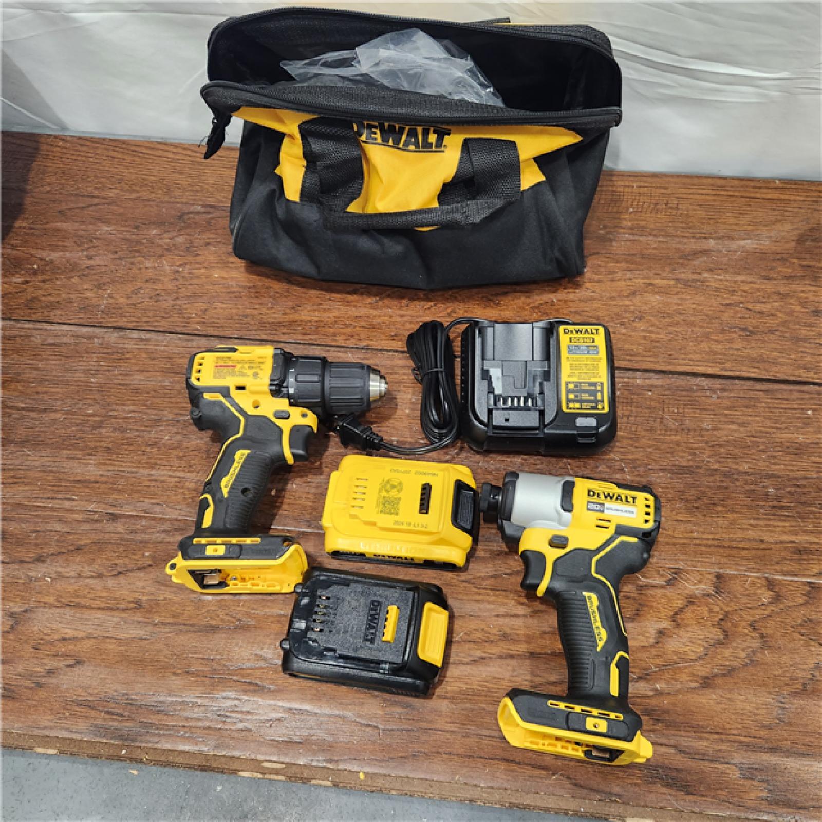 AS-IS 20V MAX XR Hammer Drill and ATOMIC Impact Driver 2 Tool Cordless Combo Kit with (2) 4.0Ah Batteries, Charger, and Bag