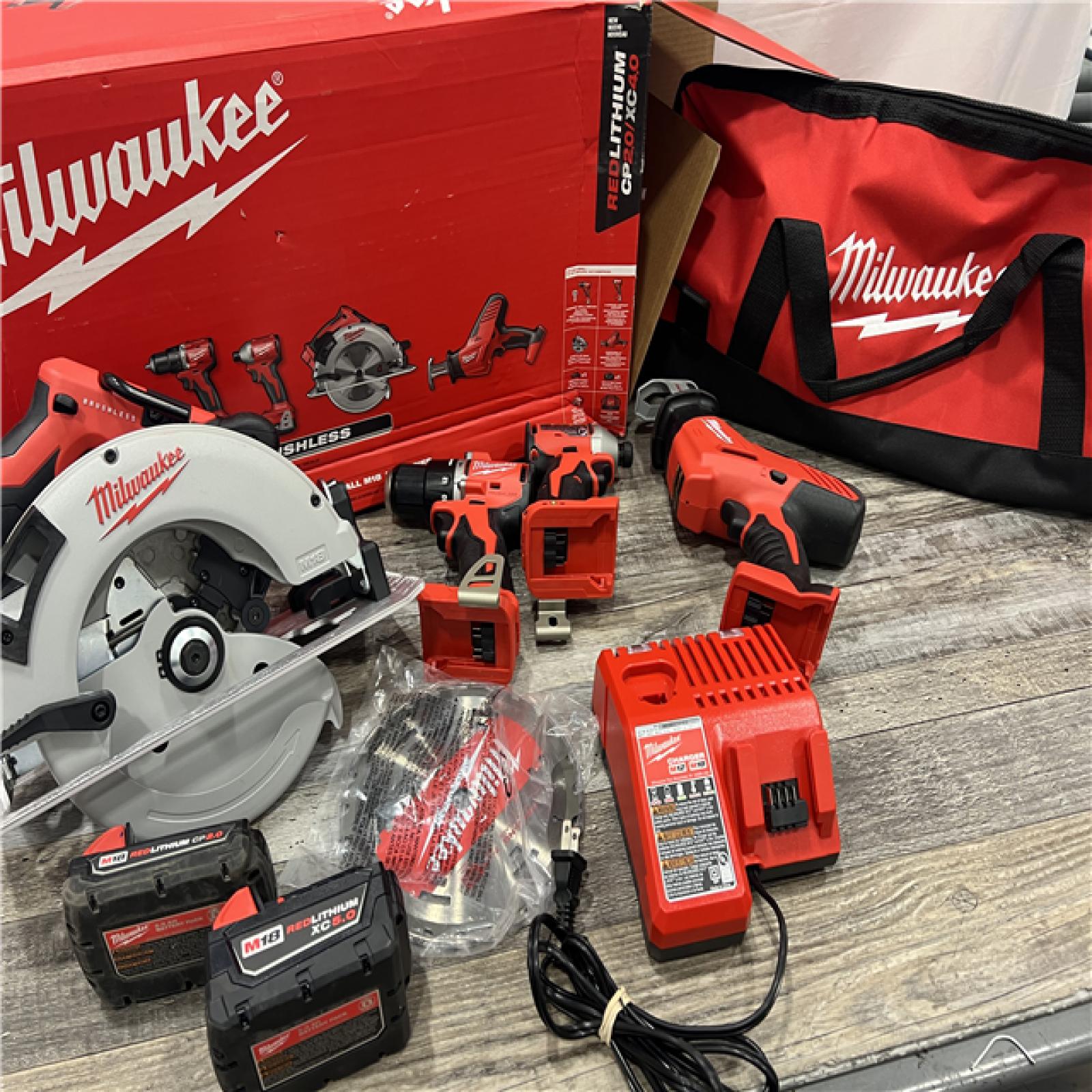 AS-IS MILWAUKEE M18 18-Volt Lithium-Ion Brushless Cordless Combo Kit (4-Tool) with 2-Batteries, 1-Charger and Tool Bag