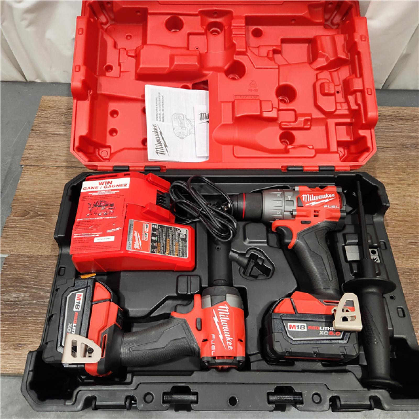 AS-IS Milwaukee M18 FUEL 18V Lithium-Ion Brushless Cordless Hammer Drill and Impact Driver Combo Kit (2-Tool) with 2 Batteries