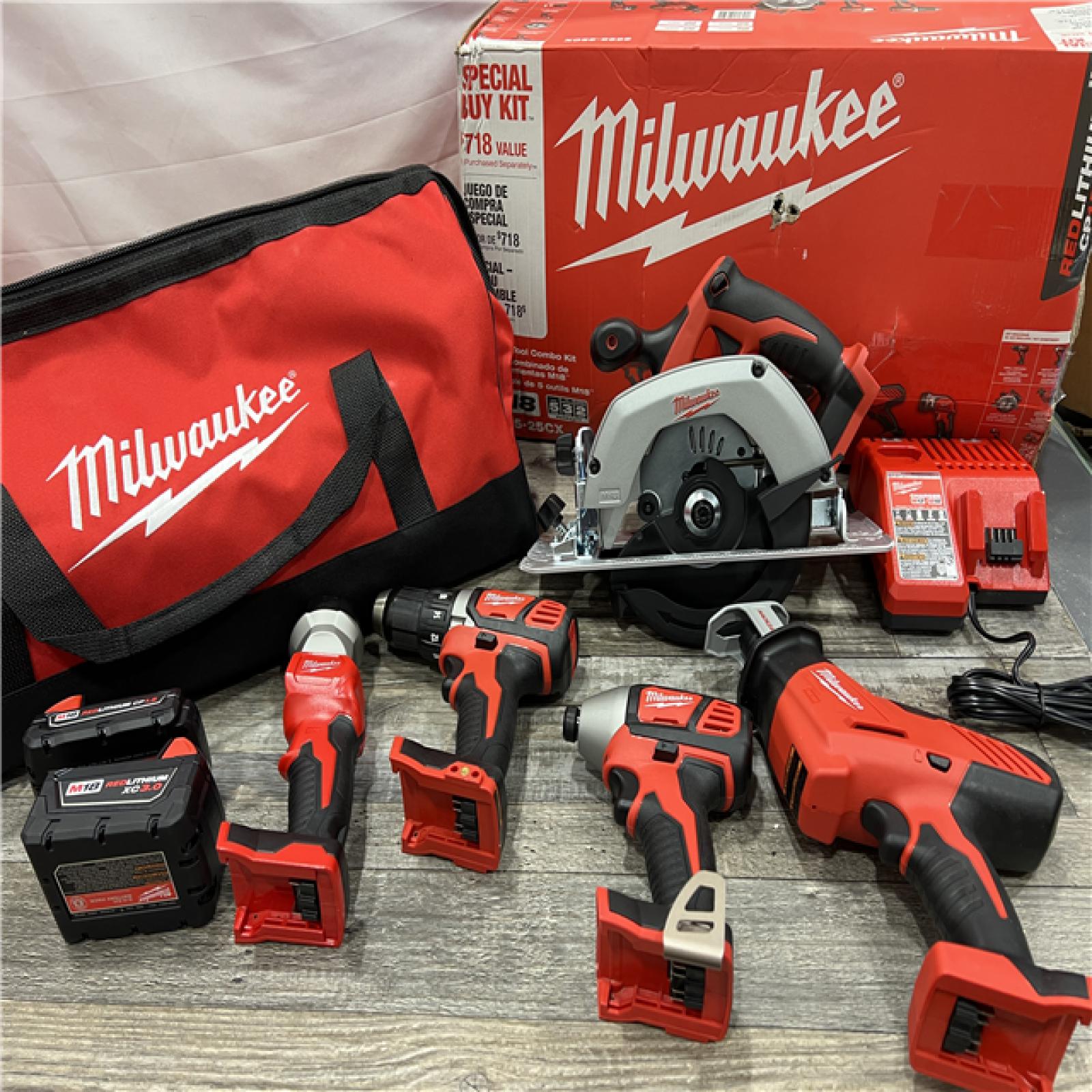 AS-IS Milwaukee M18 18-Volt Lithium-Ion Cordless Combo Tool Kit (5-Tool) with (1) 3.0Ah and (1) 1.5Ah Battery, (1) Charger, (1) Tool Bag