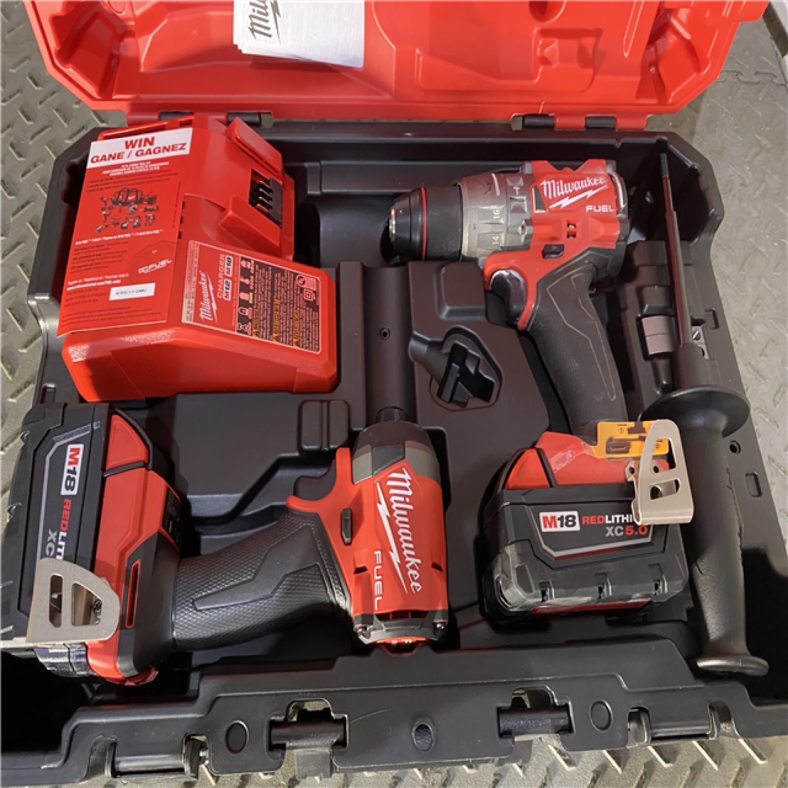 Houston location AS-IS Milwaukee 3697-22 M18 FUEL 1/2 Hammer Driller/Driver &1/4 Hex Impact Driver 2 Tool Combo Kit