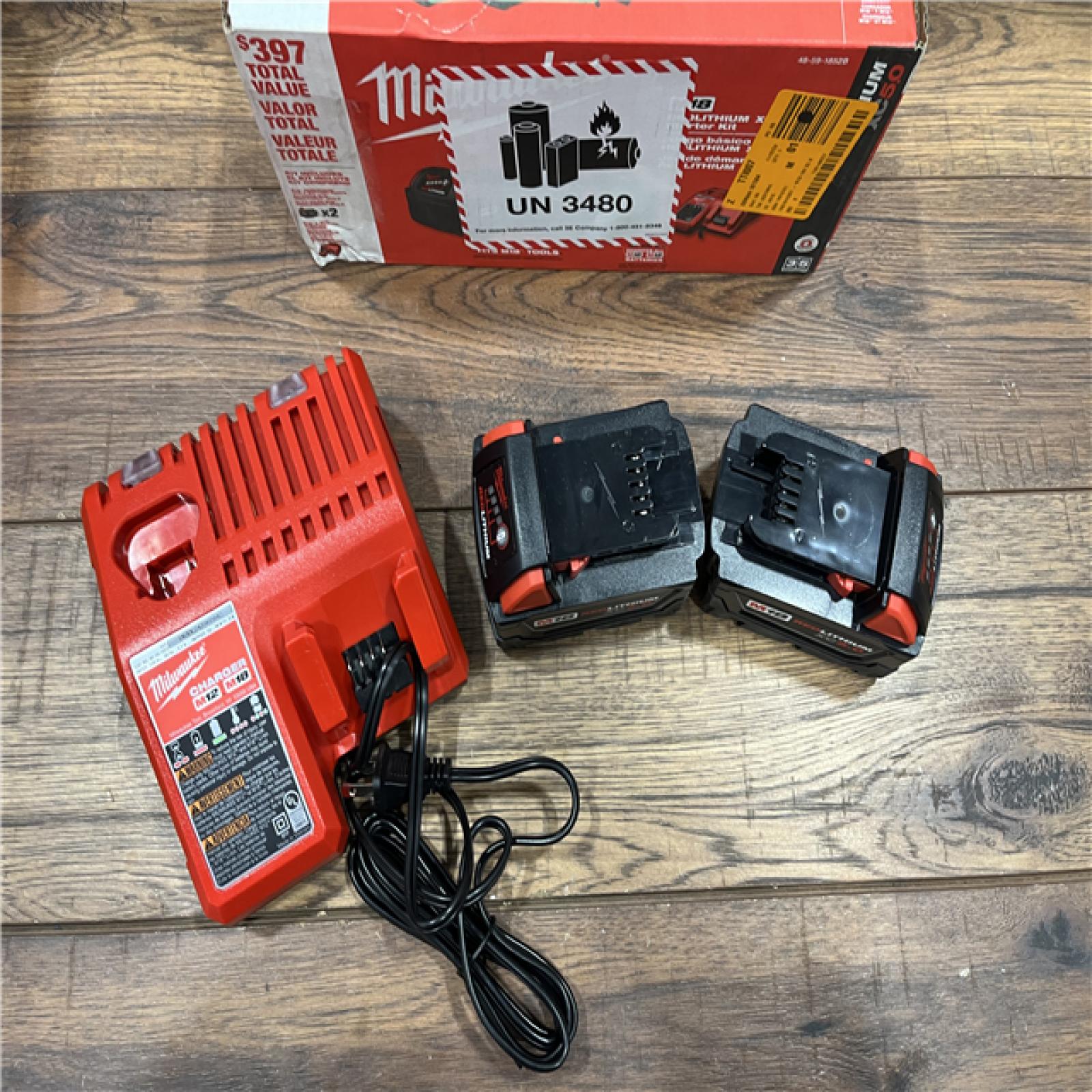 AS-IS Milwaukee M18 18-Volt Lithium-Ion XC Starter Kit with Two 5.0Ah Batteries / Charger (48-59-1852B)