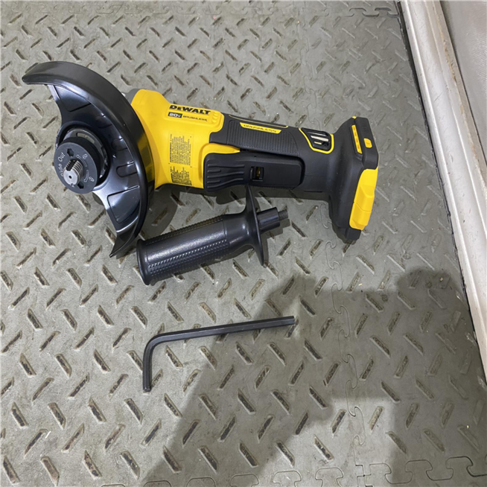 Houston location AS-IS DEWALT 20V MAX Cordless Brushless 4.5 - 5 in. Paddle Switch Angle Grinder with FLEXVOLT ADVANTAGE (Tool Only)