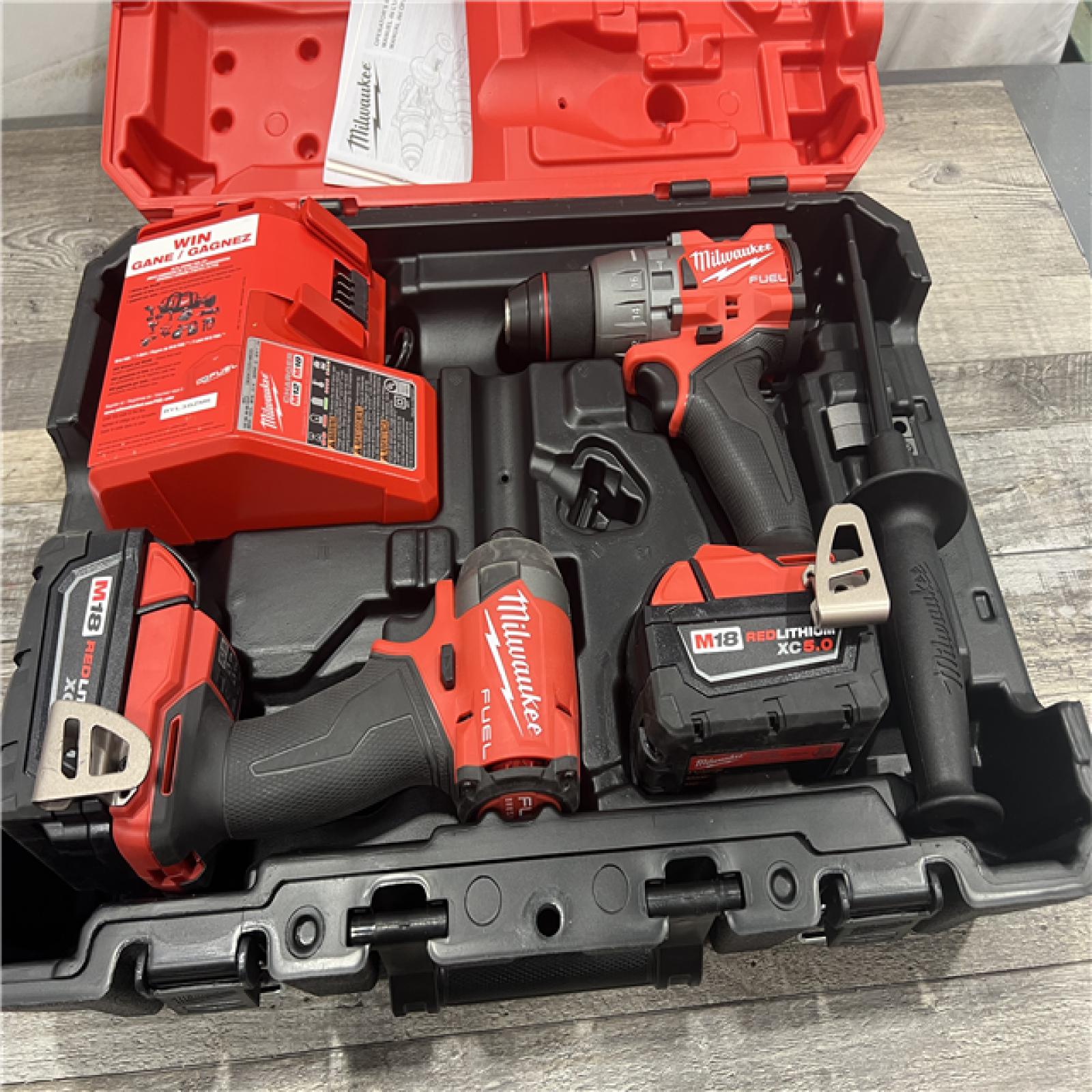 AS-IS MILWAUKEE M18 FUEL 18V Lithium-Ion Brushless Cordless Hammer Drill and Impact Driver Combo Kit (2-Tool) with 2 Batteries