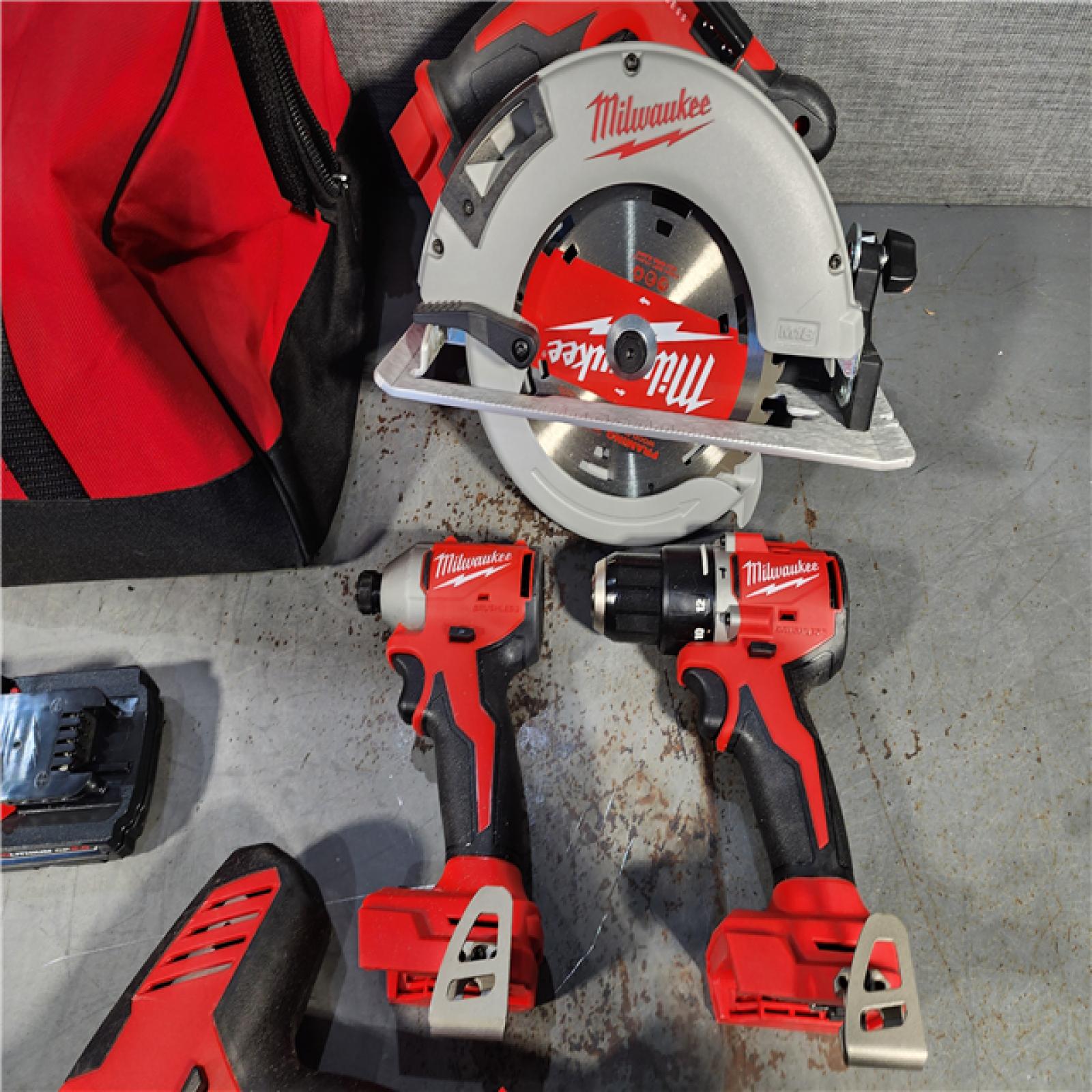 HOUSTON LOCATION - AS-IS (APPEARS LIKE NEW) Milwaukee M18 18-Volt Lithium-Ion Brushless Cordless Combo Kit (4-Tool) with 2-Batteries, 1-Charger and Tool Bag