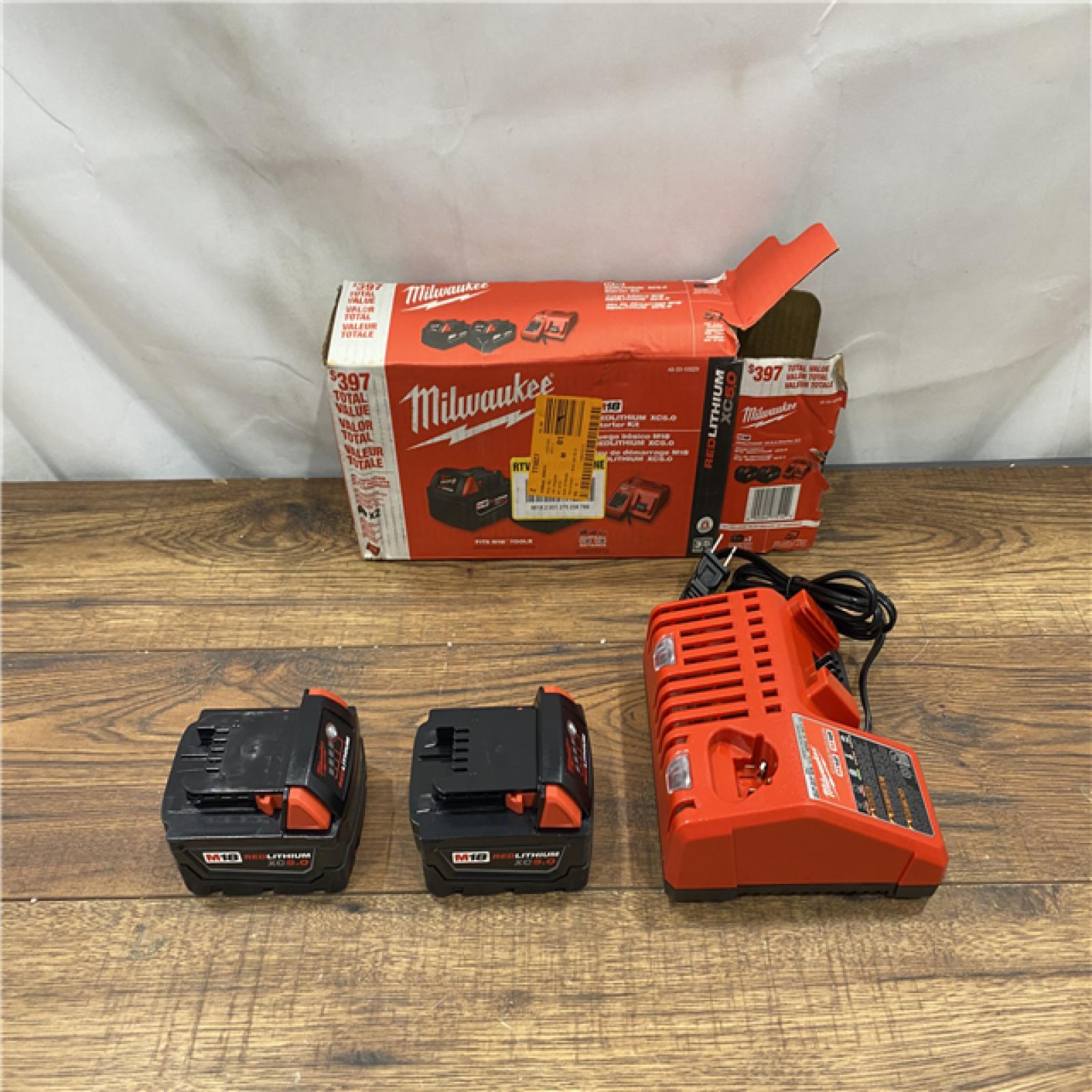 AS IS M18 18-Volt Lithium-Ion XC Starter Kit with Two 5.0Ah Batteries and Charger