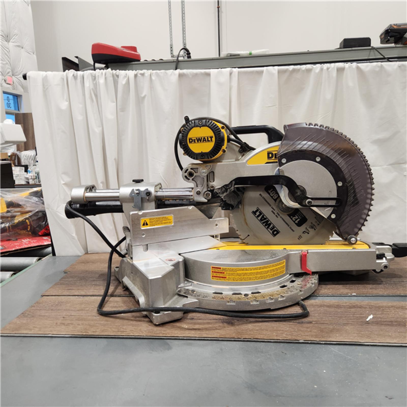 AS IS DEWALT 15 Amp Corded 12 in. Double Bevel Sliding Compound Miter Saw with XPS Technology, Blade Wrench and Material Clamp