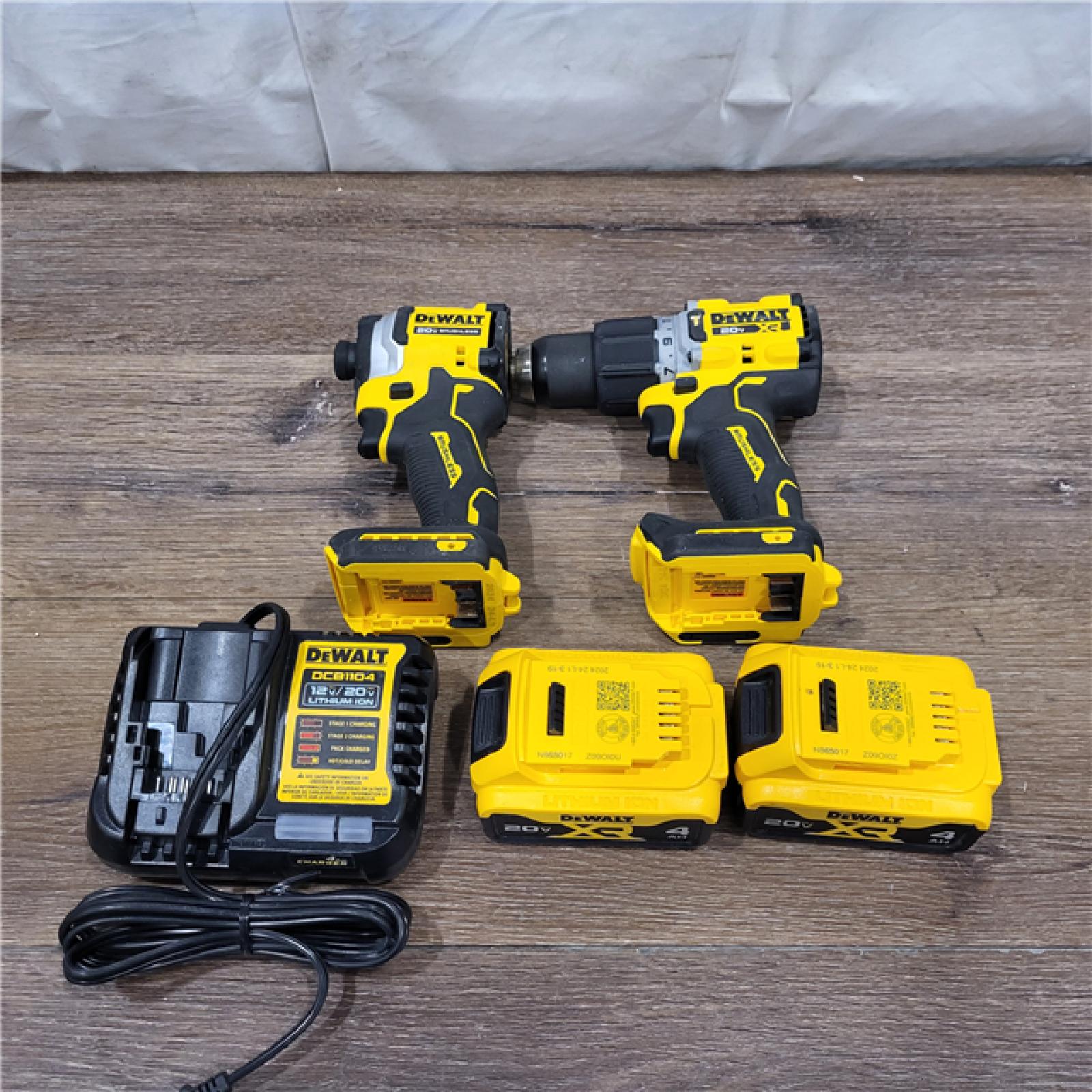 AS-IS 20V MAX XR Hammer Drill and ATOMIC Impact Driver 2 Tool Cordless Combo Kit with (2) 4.0Ah Batteries, Charger, and Bag