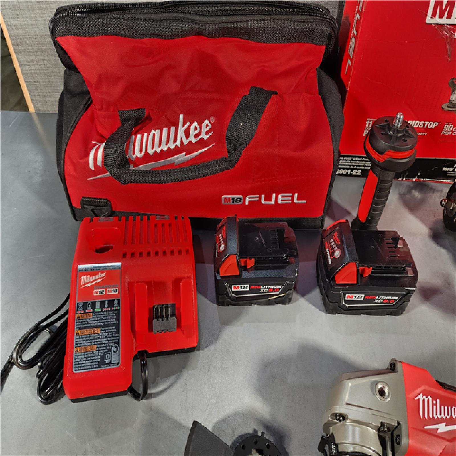 HOUSTON LOCATION - AS-IS (APPEARS LIKE NEW) M18 FUEL 18V Lithium-Ion Brushless Cordless Grinder & 3/8 in. Impact Wrench Combo Kit (2-Tool) W/ Two 5Ah Batteries