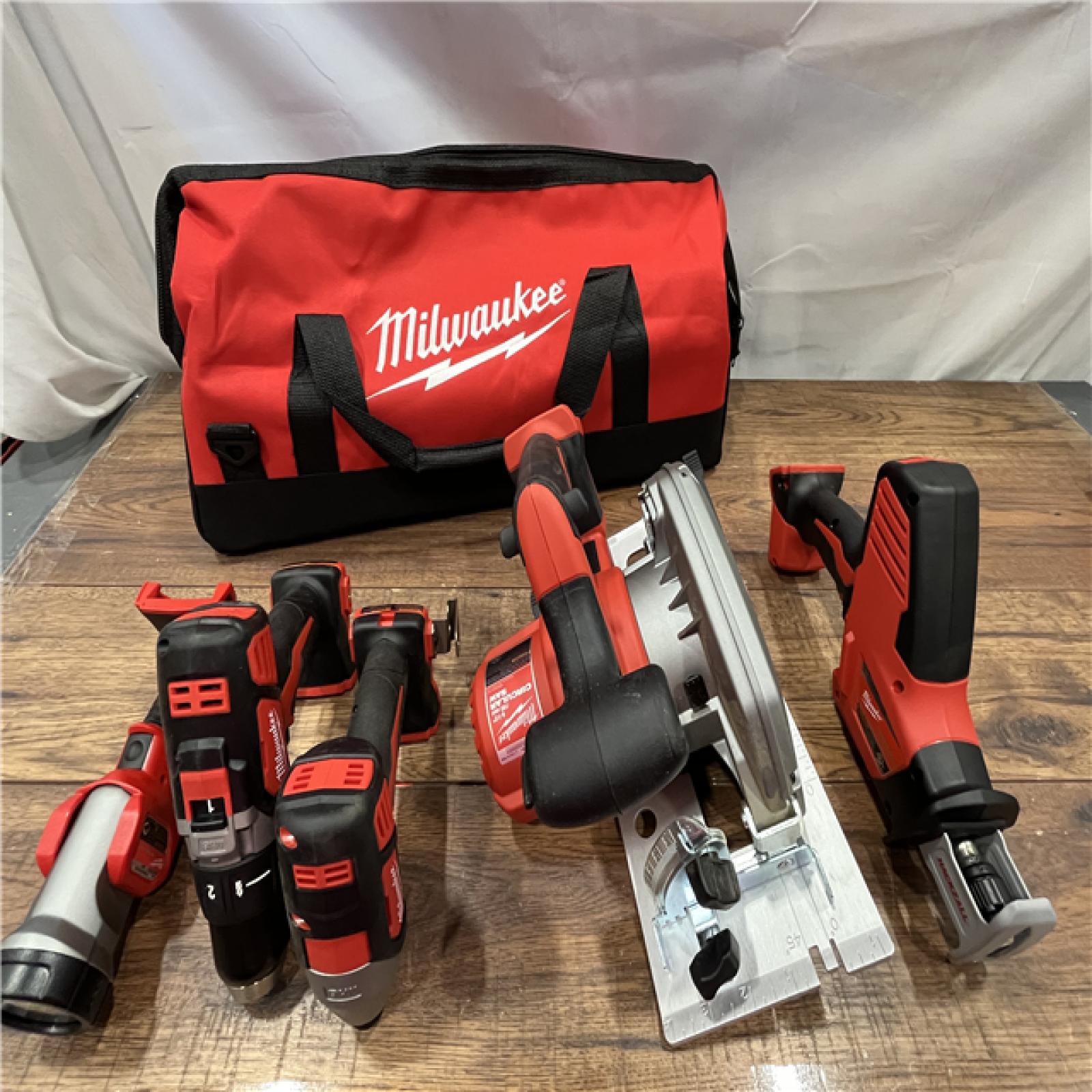 AS-IS Milwaukee M18 18-Volt Lithium-Ion Cordless Combo Tool Kit (5-Tool) with (1) 3.0Ah and (1) 1.5Ah Battery, (1) Charger, (1) Tool Bag