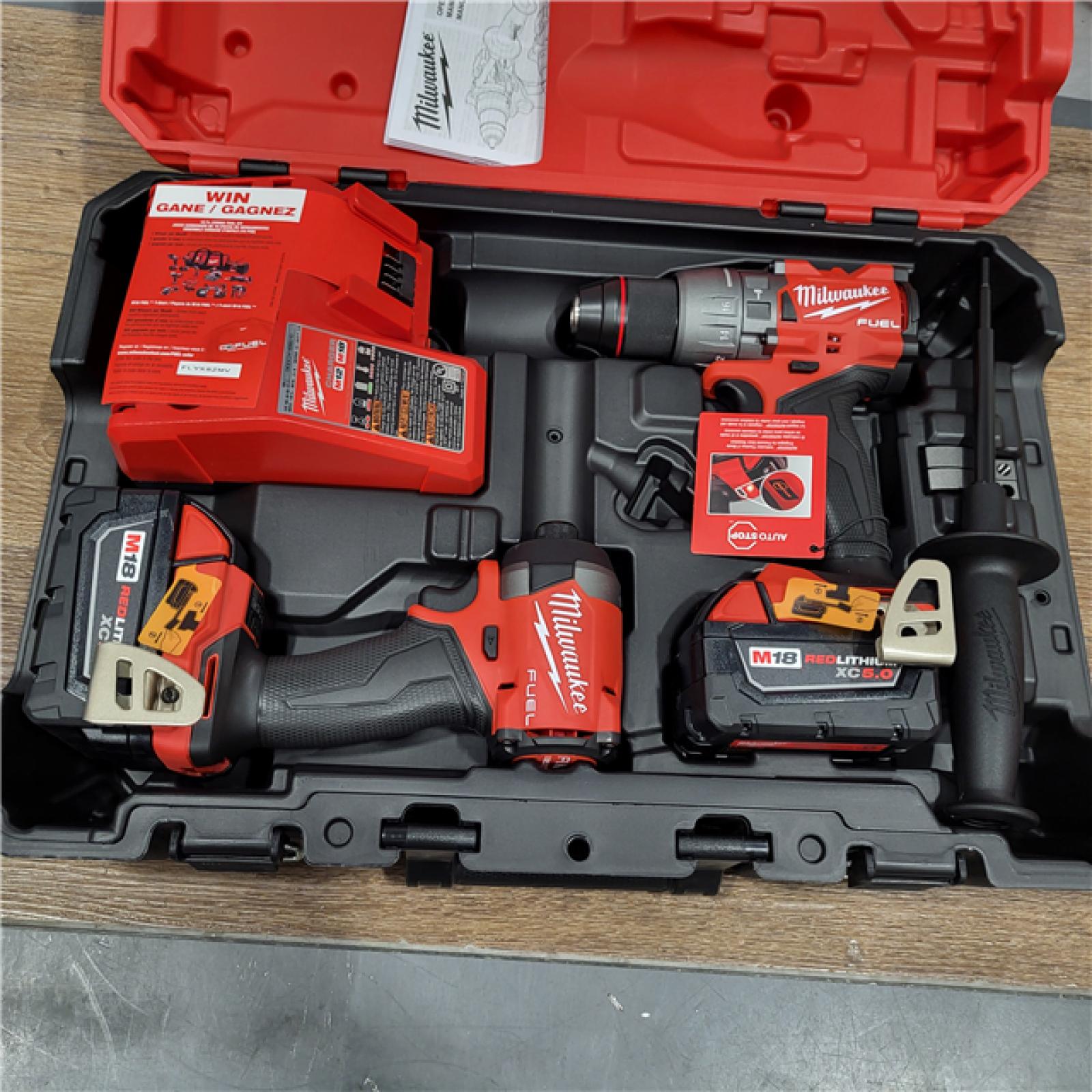 New AS-IS Milwaukee M18 FUEL 18V Lithium-Ion Brushless Cordless Hammer Drill and Impact Driver Combo Kit (2-Tool) with 2 Batteries