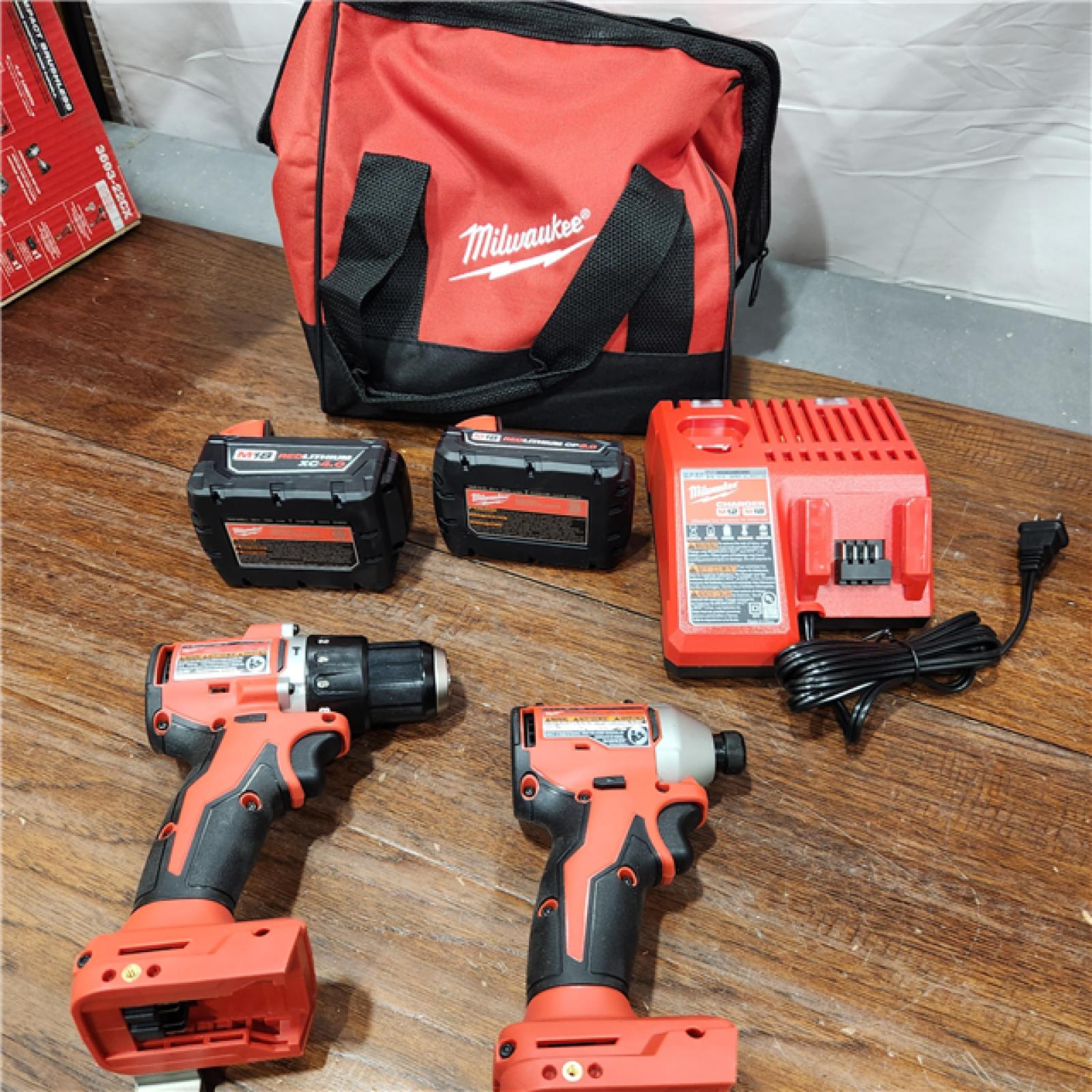 AS-IS M18 18-Volt Lithium-Ion Brushless Cordless Compact Hammer Drill/Impact Combo Kit (2-Tool) with (2) Batteries, Bag