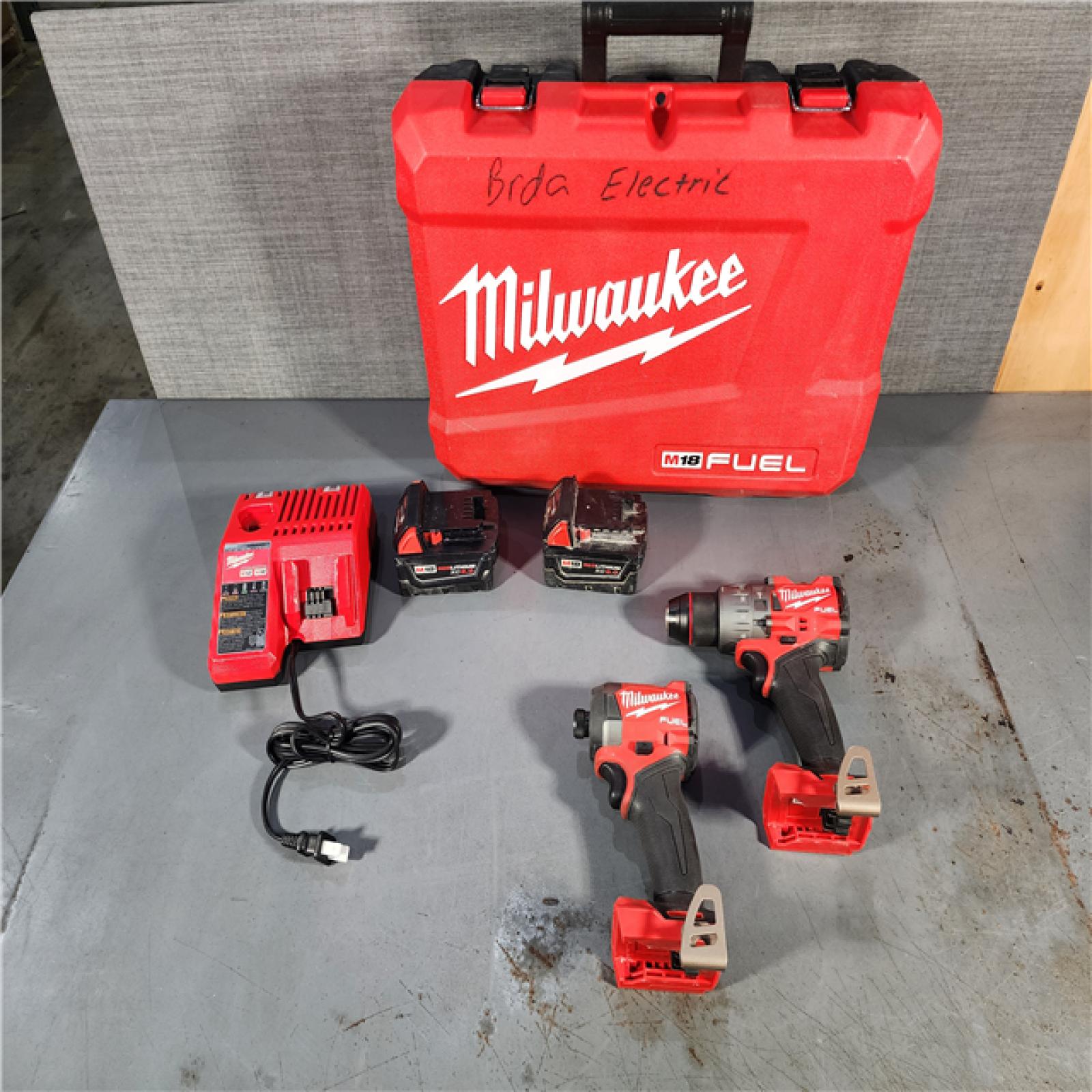 HOUSTON LOCATION - AS-IS Milwaukee M18 FUEL 18V Lithium-Ion Brushless Cordless Hammer Drill and Impact Driver Combo Kit (2-Tool) with 2 Batteries