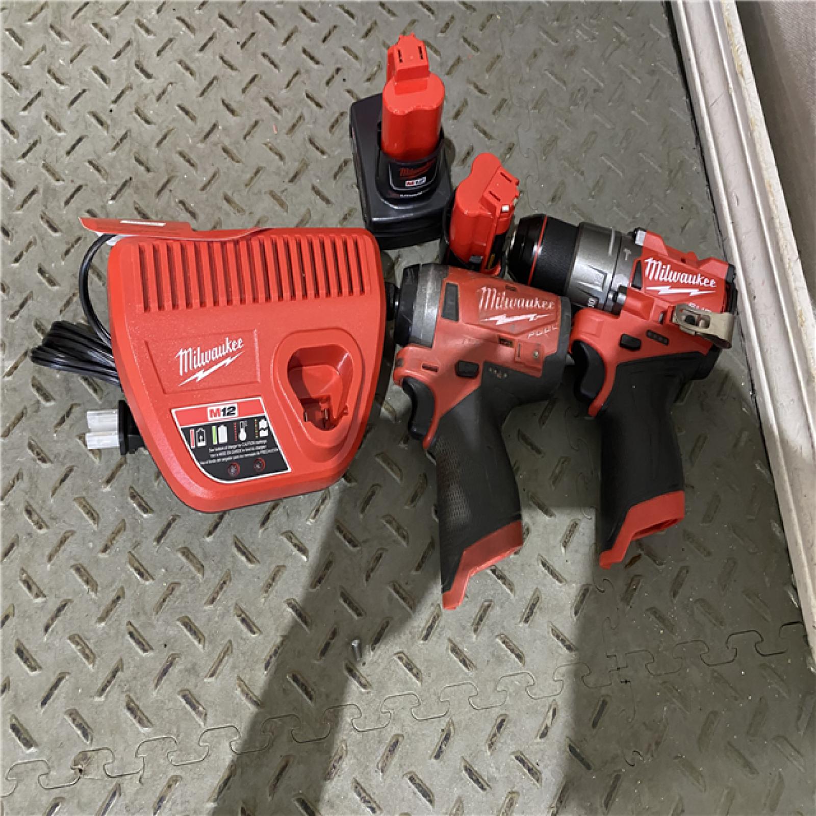 Houston location AS-IS Milwaukee 3497-22 12V Brushless Hammer Drill and Impact Driver Combo Kit