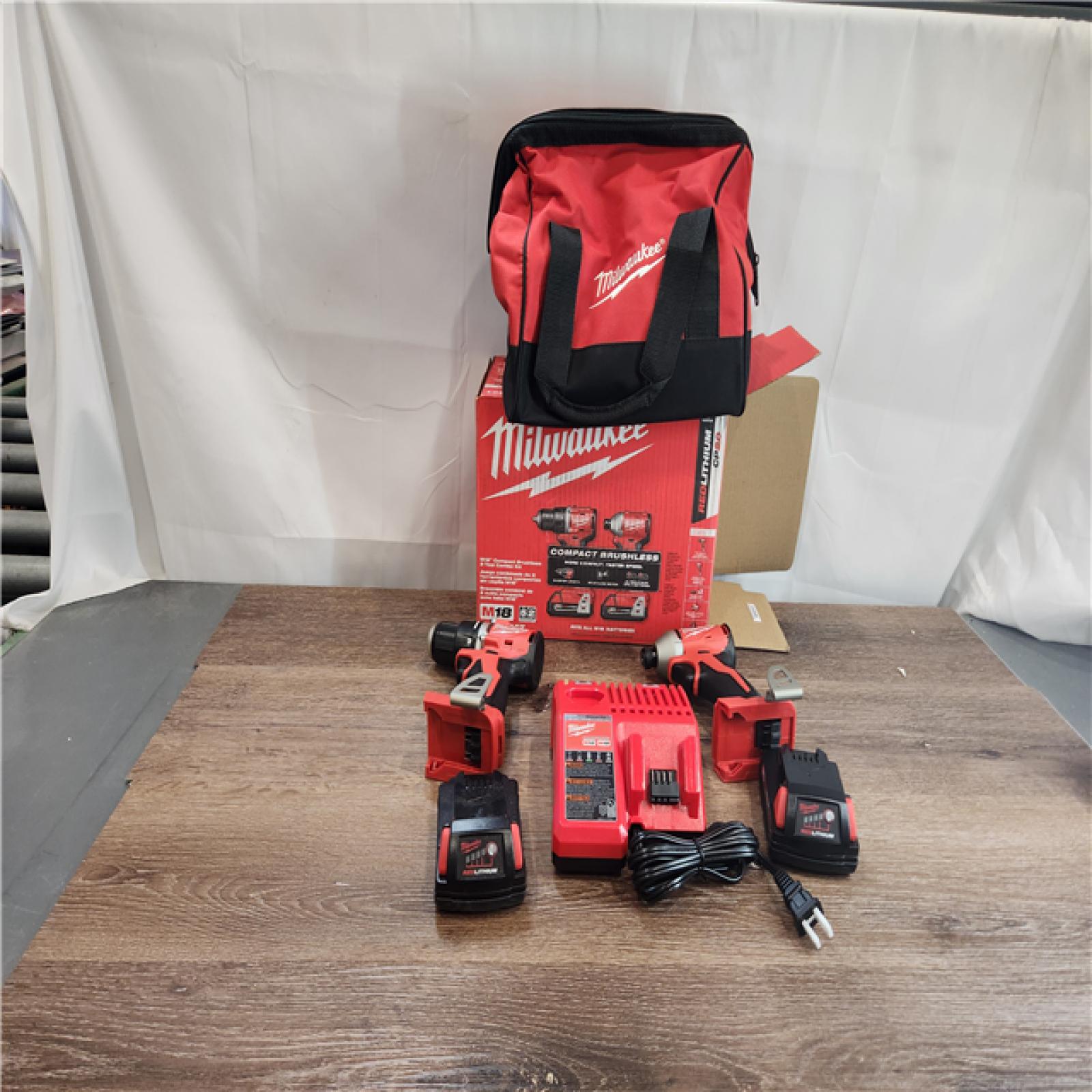 AS-IS Milwaukee 3692-22CT 18V M18 Lithium-Ion Compact Brushless Cordless 2-Tool Combo Kit with 1/2 Drill/Driver and 1/4 Hex Impact Driver 2.0 Ah