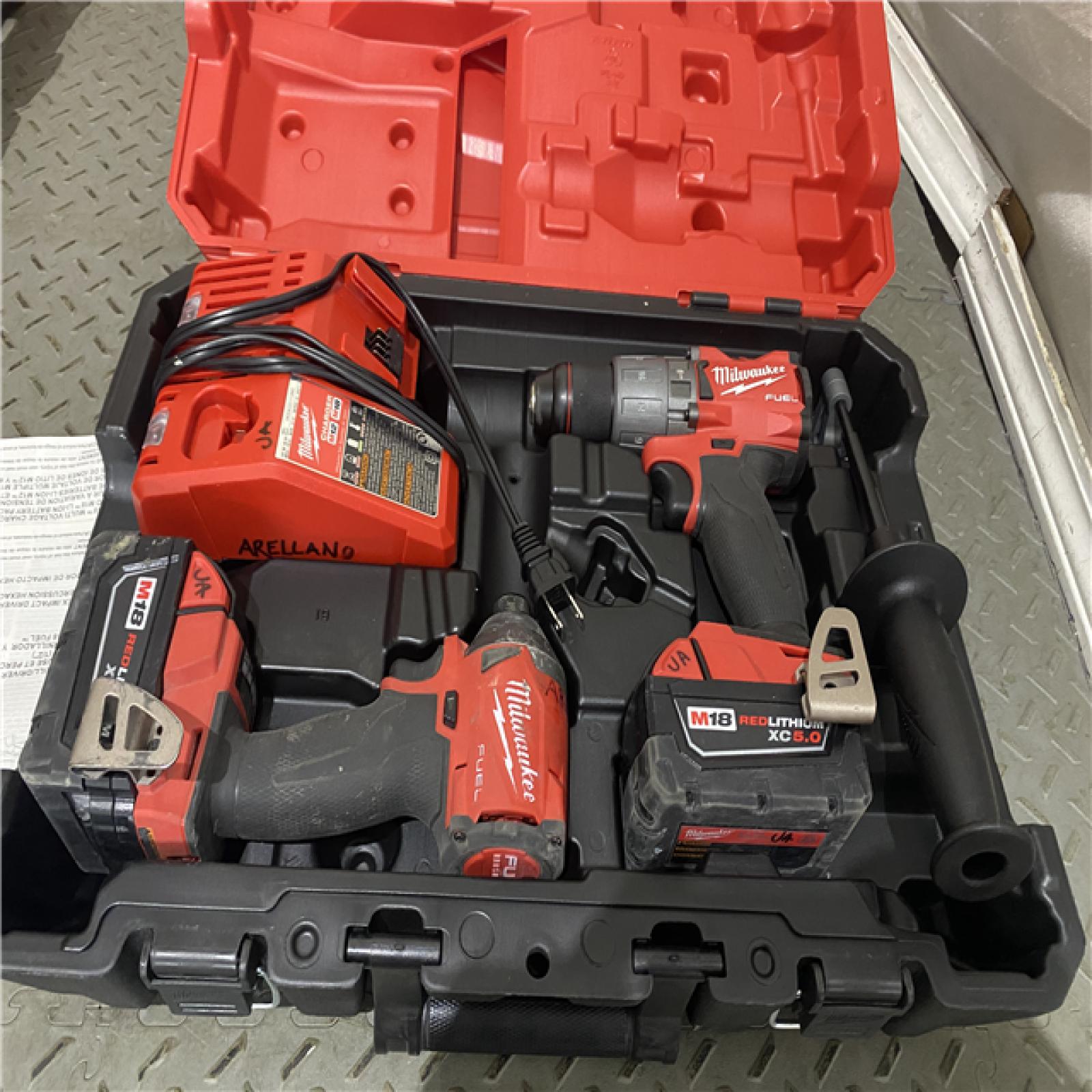 Houston location AS-IS Milwaukee M18â„¢ FUELâ„¢ 2-Tool Hammer Drill/Impact Driver Combo Kit - by International Tool