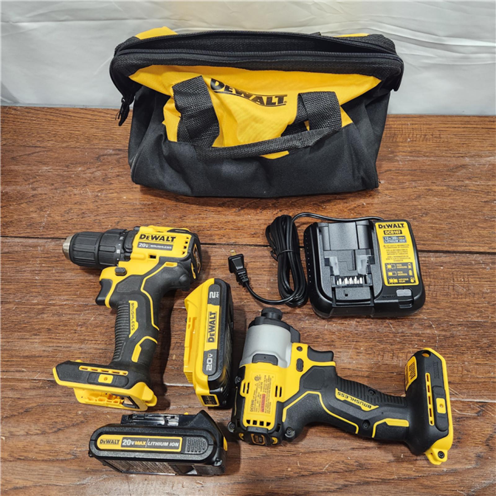 AS-IS 20V MAX XR Hammer Drill and ATOMIC Impact Driver 2 Tool Cordless Combo Kit with (2) 4.0Ah Batteries, Charger, and Bag