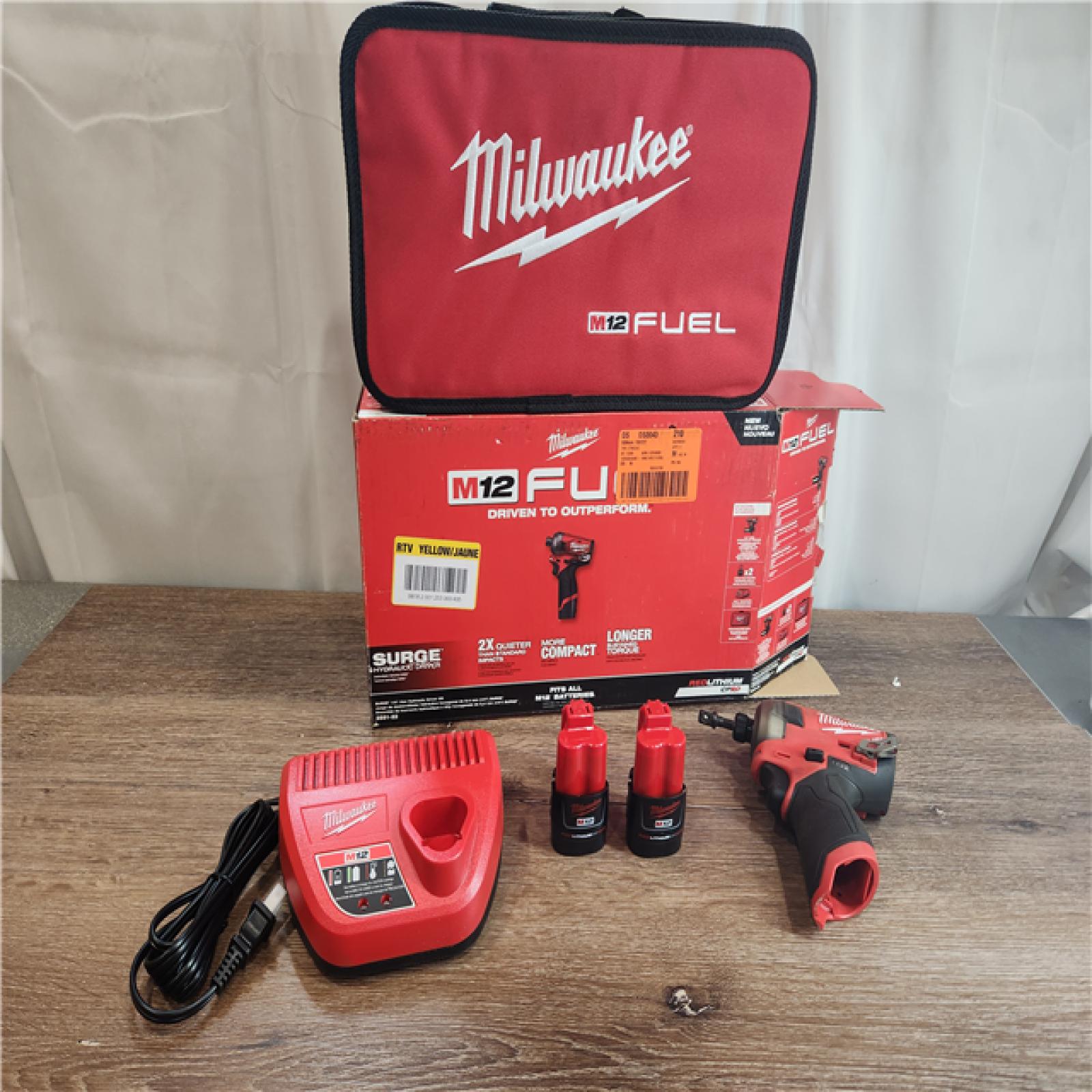 AS-IS Milwaukee M12 1/4  12V Brushless Hex Impact Driver Kit 2551-22 with (2) 2Ah Batteries  Charger  & Tool Bag