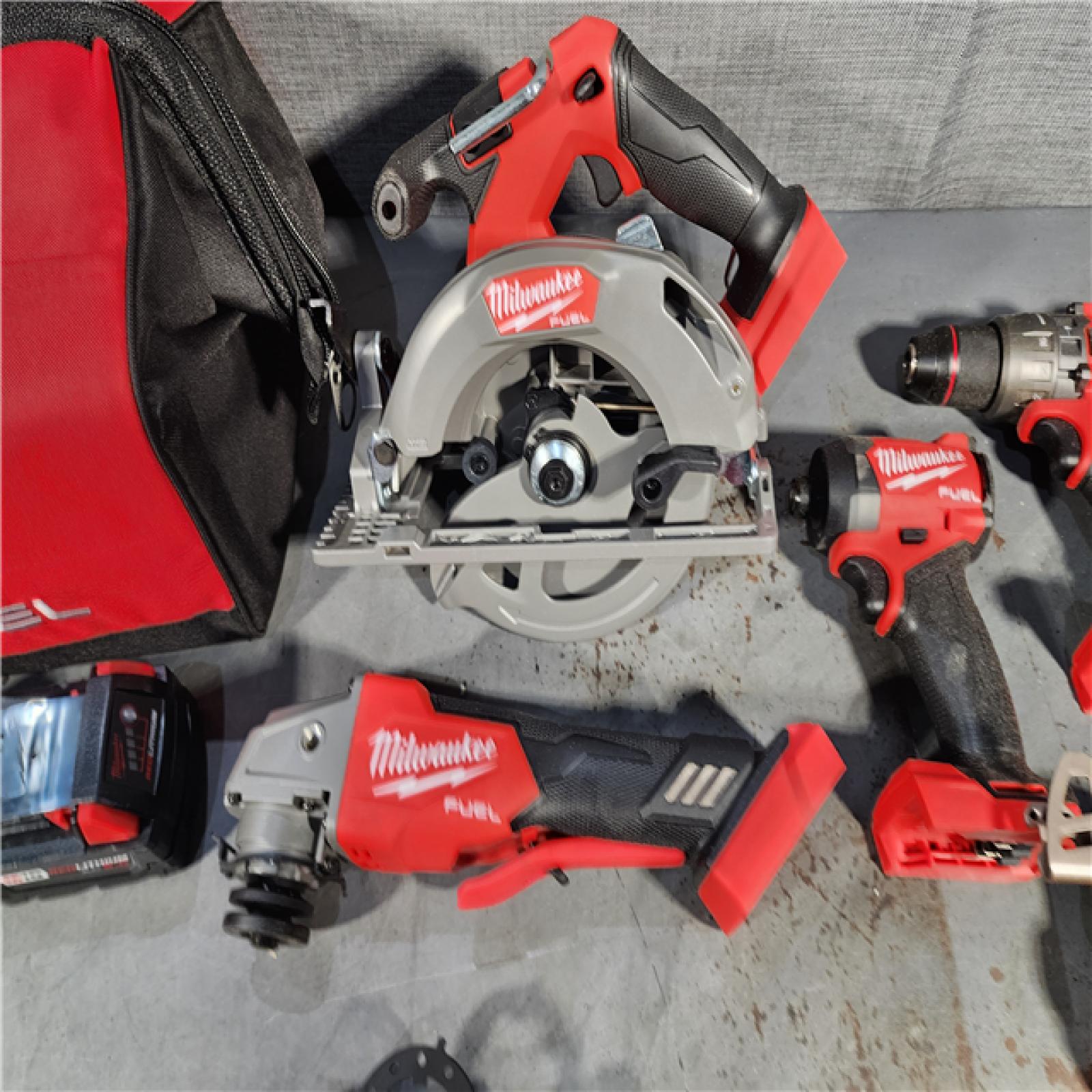 HOUSTON LOCATION - AS-IS (APPEARS LIKE NEW) M18 18-Volt Lithium-Ion Brushless Cordless FUEL Combo Kit (5-Tool) with 2-Batteries, 1-Charger, and Tool Bag