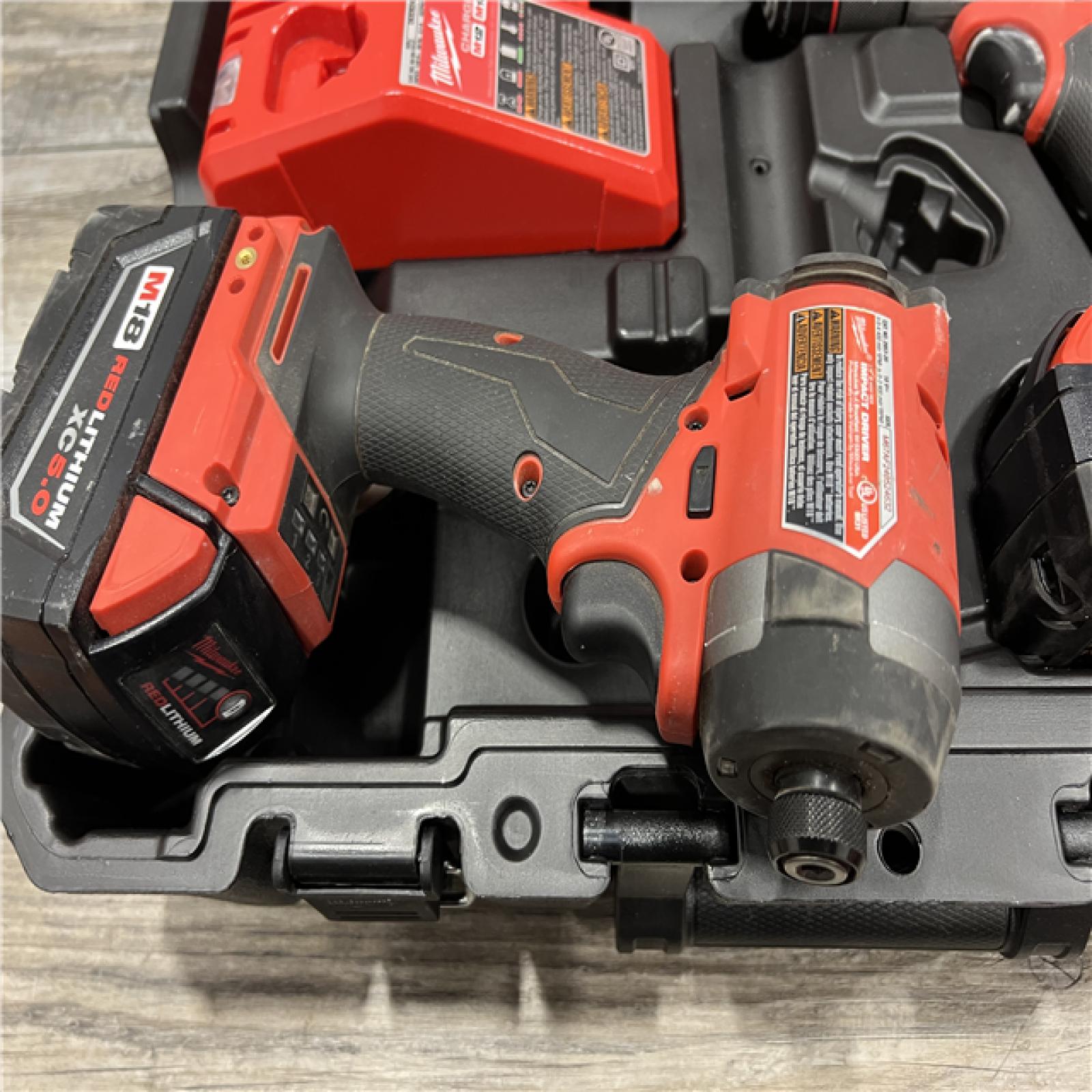 AS-IS MILWAUKEE M18 FUEL 18V Lithium-Ion Brushless Cordless Hammer Drill and Impact Driver Combo Kit (2-Tool) with 2 Batteries