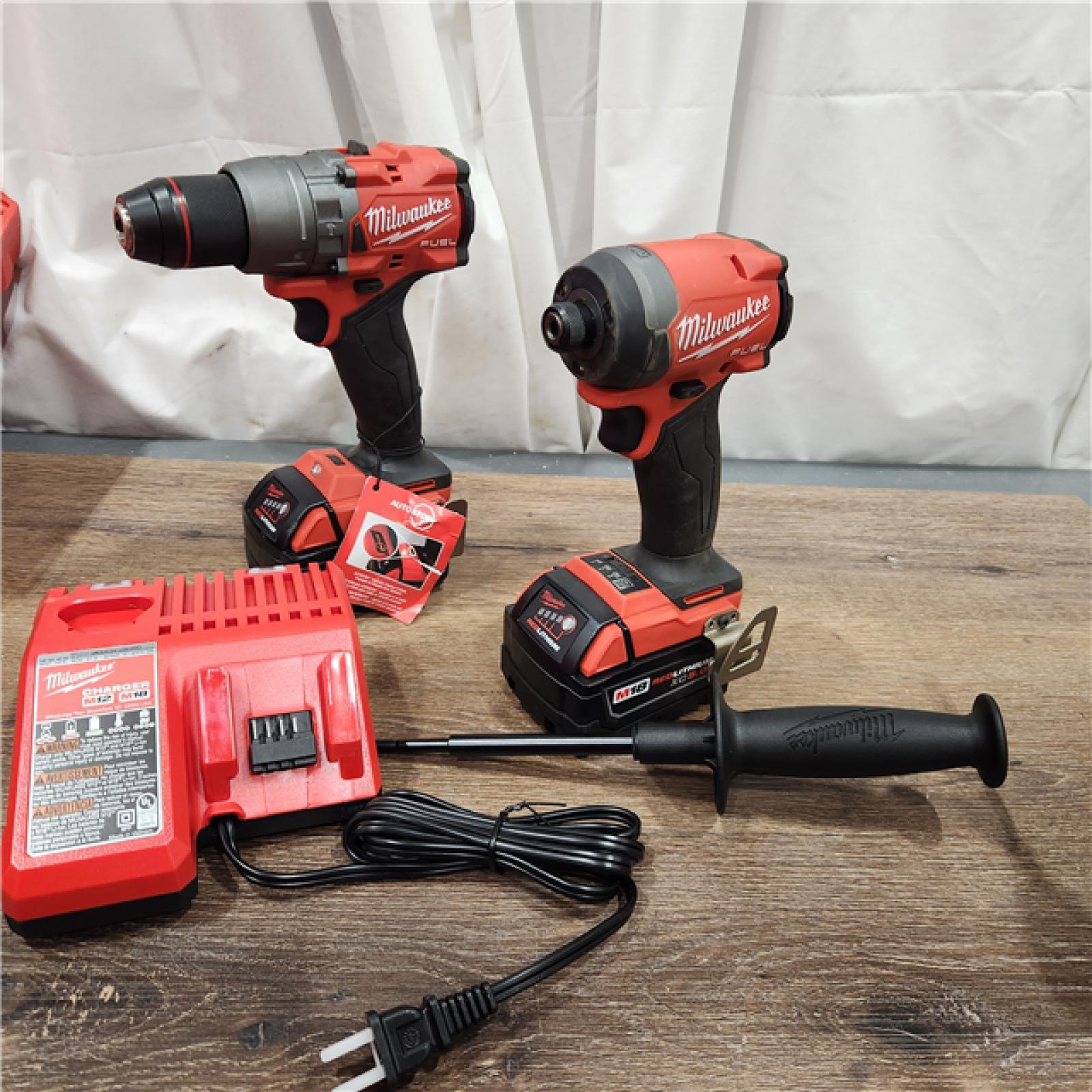 AS-IS Milwaukee M18 FUEL 18V Lithium-Ion Brushless Cordless Hammer Drill and Impact Driver Combo Kit (2-Tool) with 2 Batteries