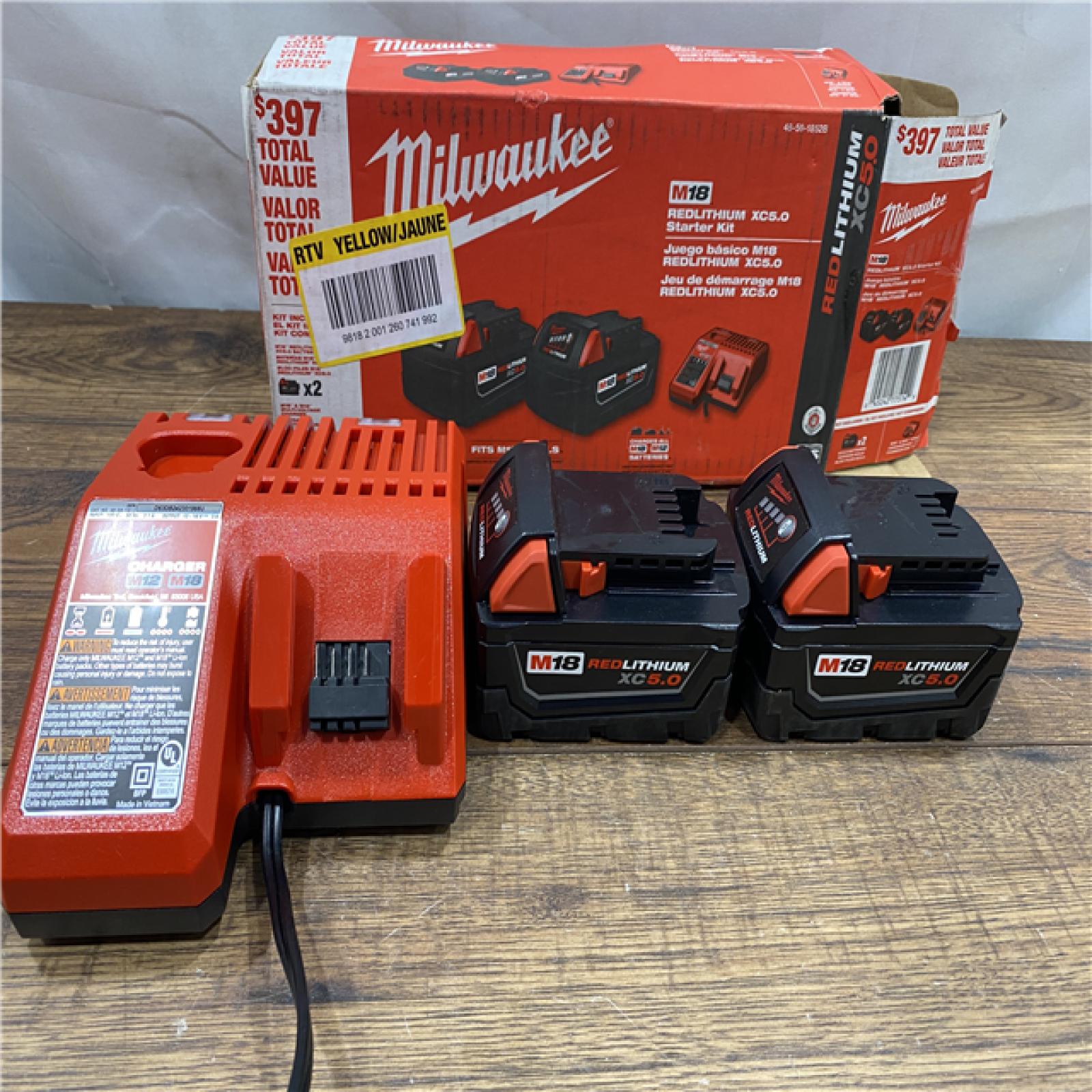 AS IS Milwaukee M18 18-Volt Lithium-Ion XC Starter Kit with Two 5.0Ah Batteries / Charger (48-59-1852B)