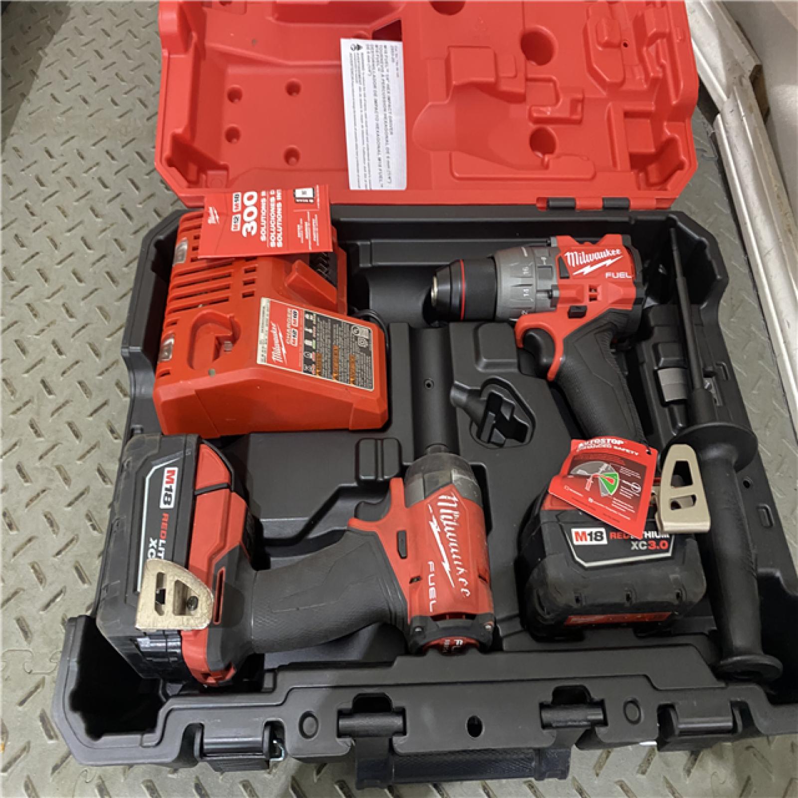 Houston location AS-IS MILWAUIKEE M18 FUEL 18V Lithium-Ion Brushless Cordless Hammer Drill and Impact Driver Combo Kit (2-Tool) with 2 Batteries