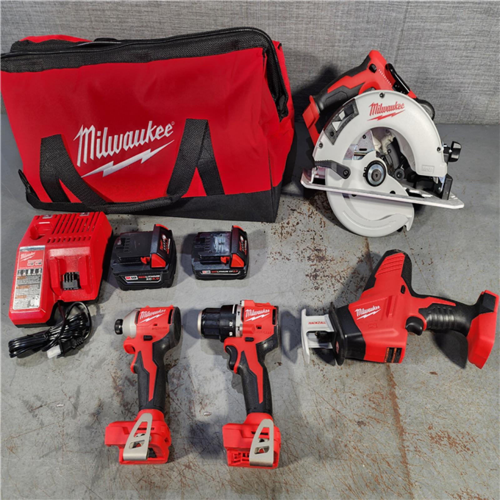 HOUSTON LOCATION - AS-IS (APPEARS LIKE NEW) Milwaukee M18 18-Volt Lithium-Ion Brushless Cordless Combo Kit (4-Tool) with 2-Batteries, 1-Charger and Tool Bag