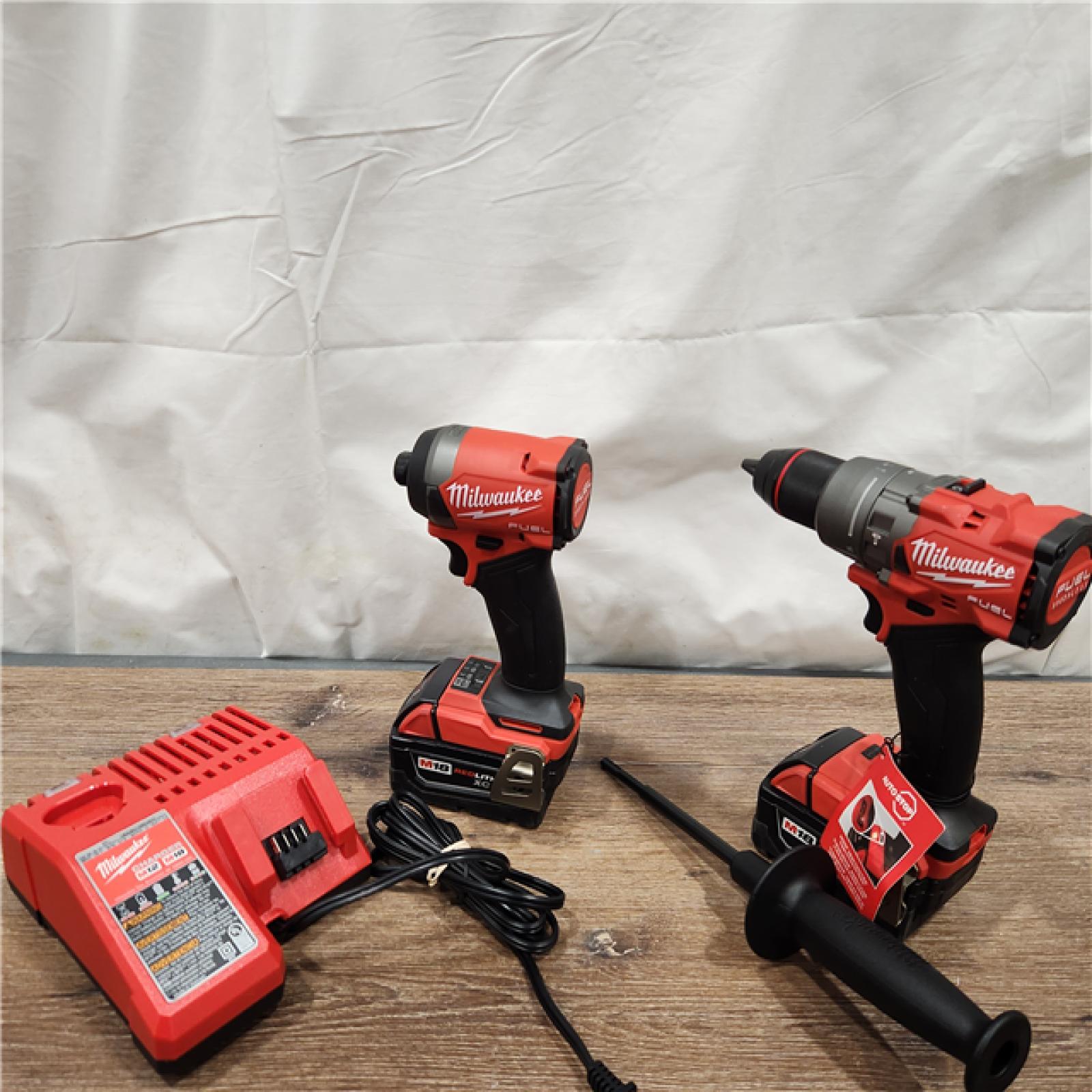 AS-IS Milwaukee M18 FUEL 18V Lithium-Ion Brushless Cordless Hammer Drill and Impact Driver Combo Kit (2-Tool) with 2 Batteries