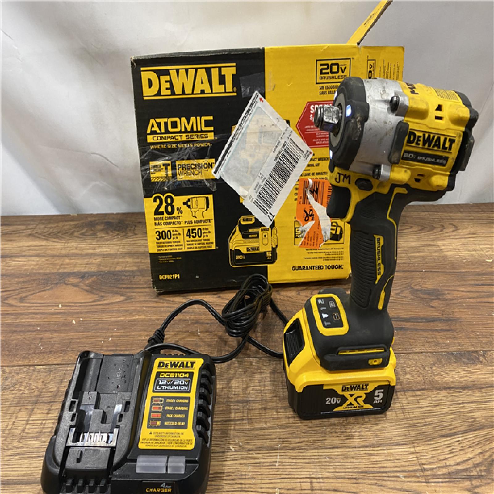 AS IS DEWALT ATOMIC 20V MAX Lithium-Ion Brushless Cordless 1/2 in. Variable Speed Impact Wrench Kit with 5 Ah Battery and Charger