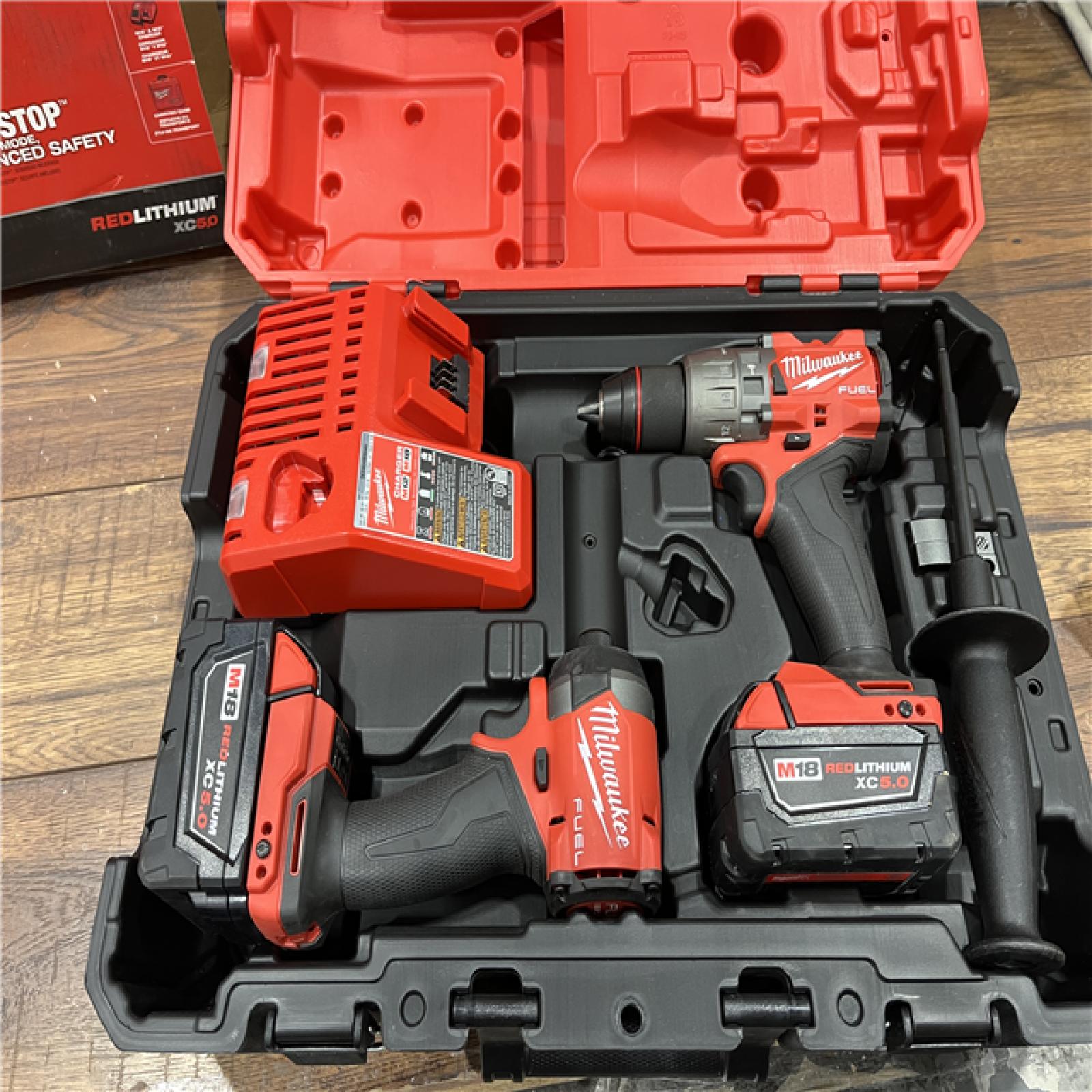 AS-IS Milwaukee M18 FUEL 18V Lithium-Ion Brushless Cordless Hammer Drill and Impact Driver Combo Kit (2-Tool) with 2 Batteries