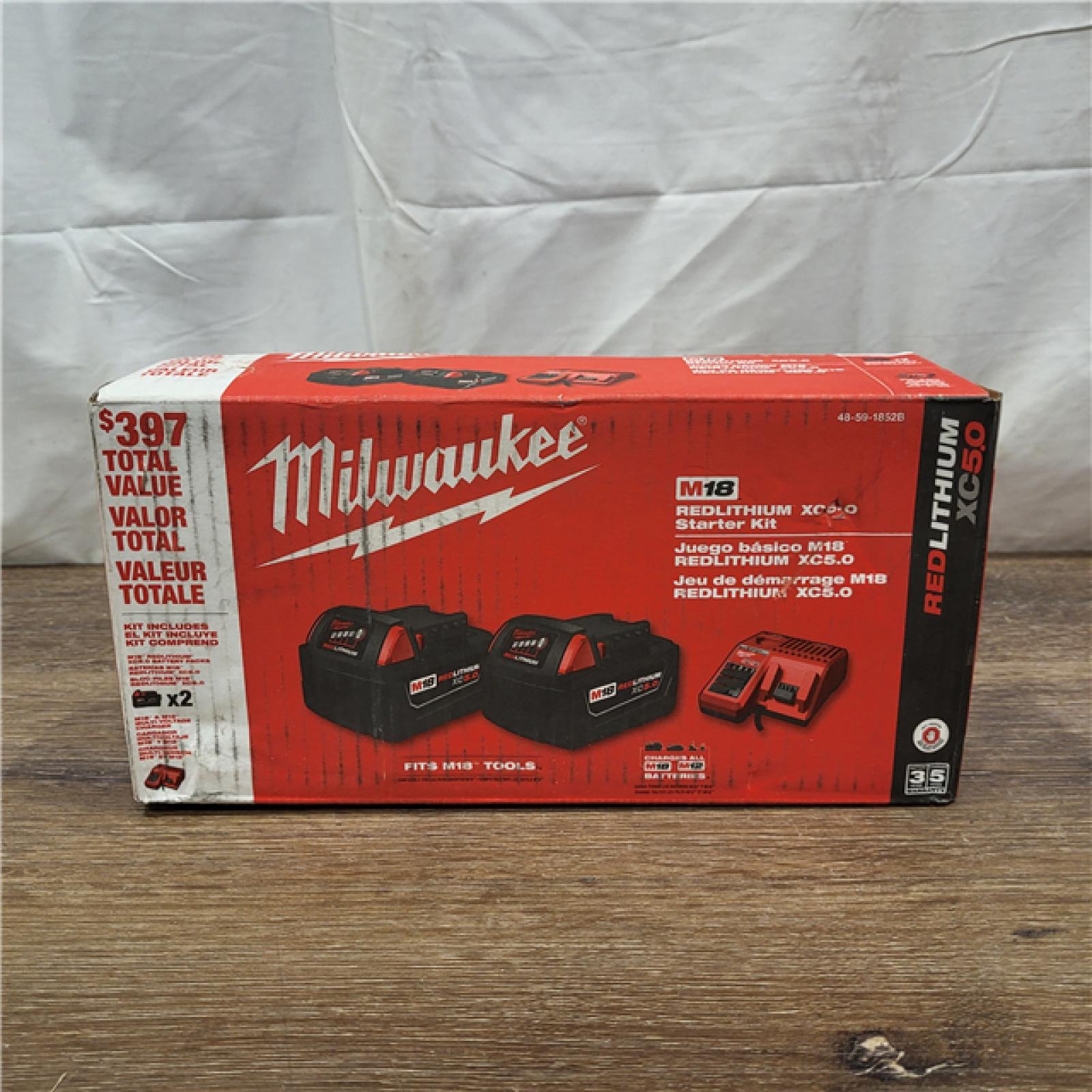 AS-IS Milwaukee M18 18-Volt Lithium-Ion XC Starter Kit with Two 5.0Ah Batteries / Charger (48-59-1852B)