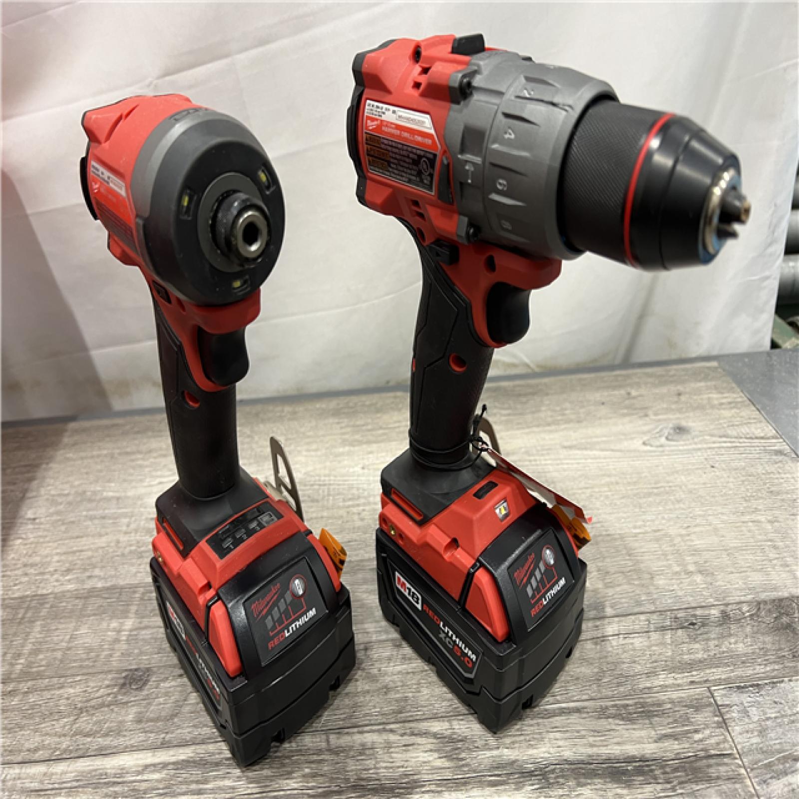 AS-IS Milwaukee M18 FUEL 18V Lithium-Ion Brushless Cordless Hammer Drill and Impact Driver Combo Kit (2-Tool) with 2 Batteries