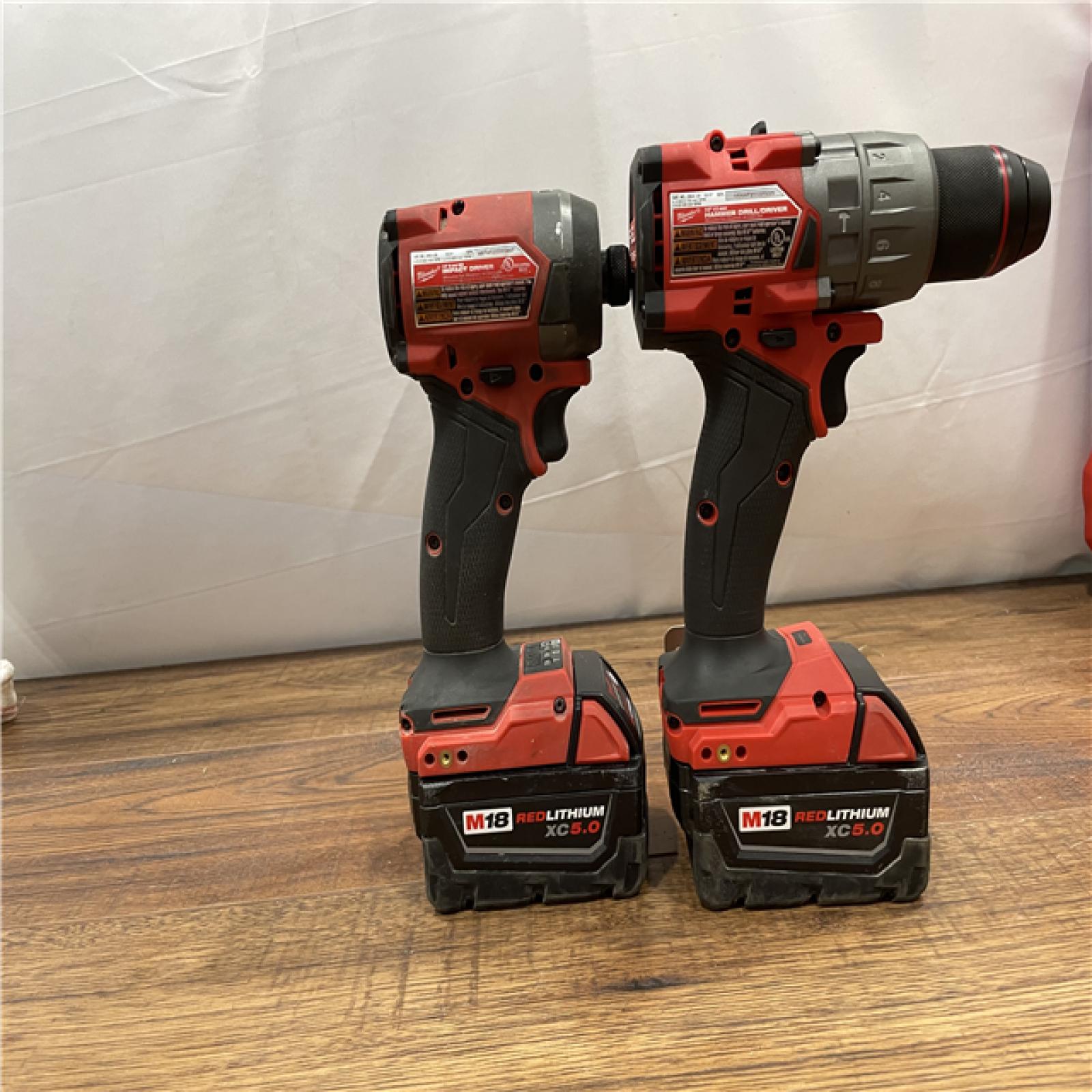 AS-IS MILWAUKEE M18 FUEL 18V Lithium-Ion Brushless Cordless Hammer Drill and Impact Driver Combo Kit (2-Tool)