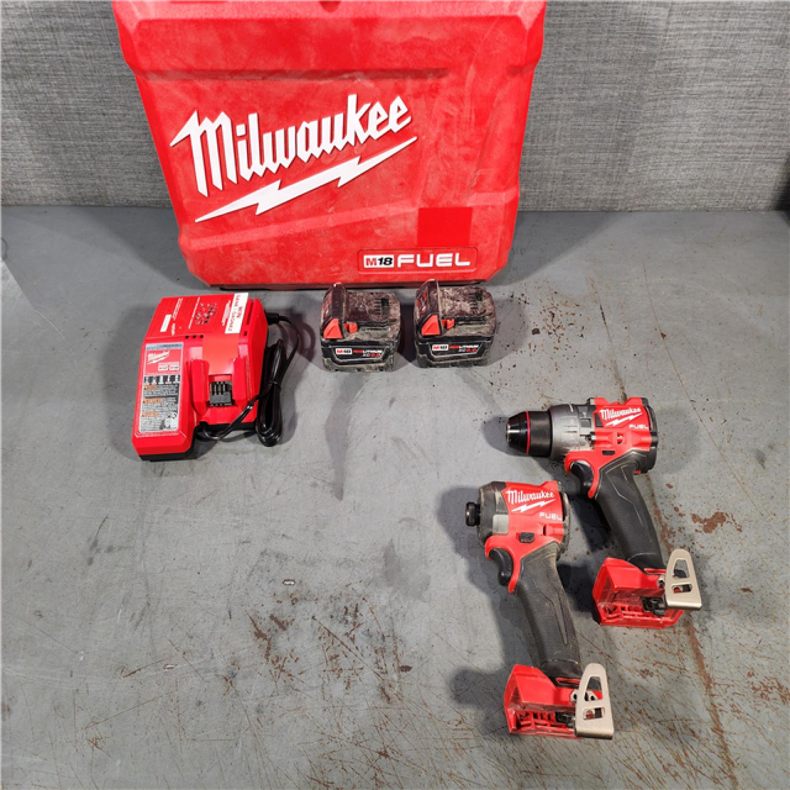 HOUSTON LOCATION - AS-IS Milwaukee M18 FUEL 18V Lithium-Ion Brushless Cordless Hammer Drill and Impact Driver Combo Kit (2-Tool) with 2 Batteries