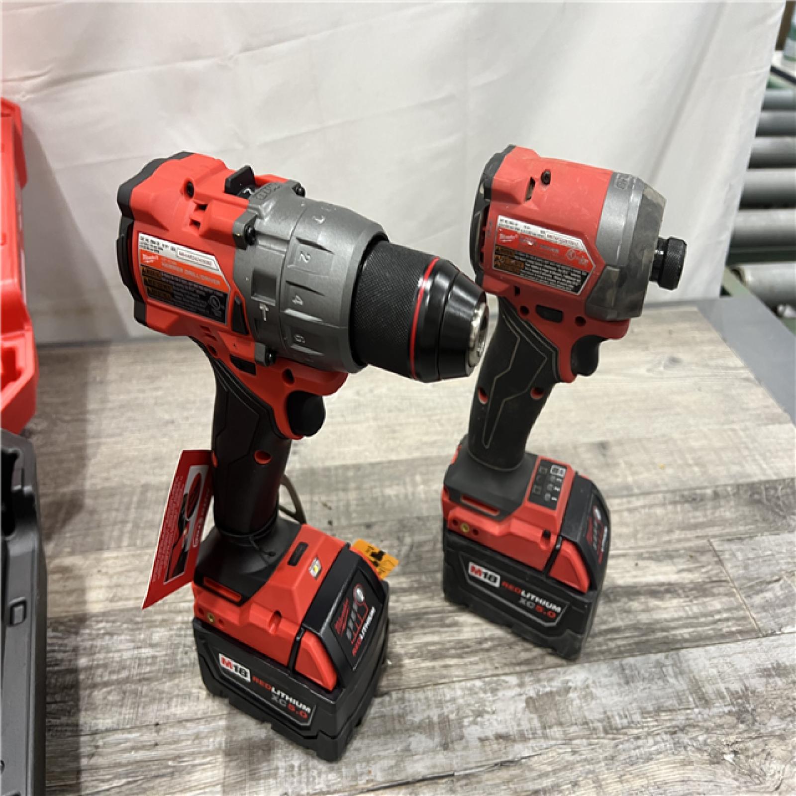 AS-IS MILWAUKEE M18 FUEL 18V Lithium-Ion Brushless Cordless Hammer Drill and Impact Driver Combo Kit (2-Tool) with 2 Batteries